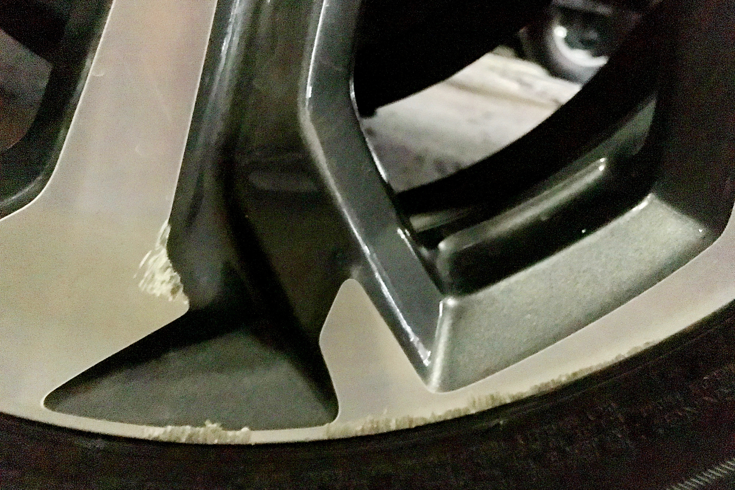 Aluminum car wheel with damage.