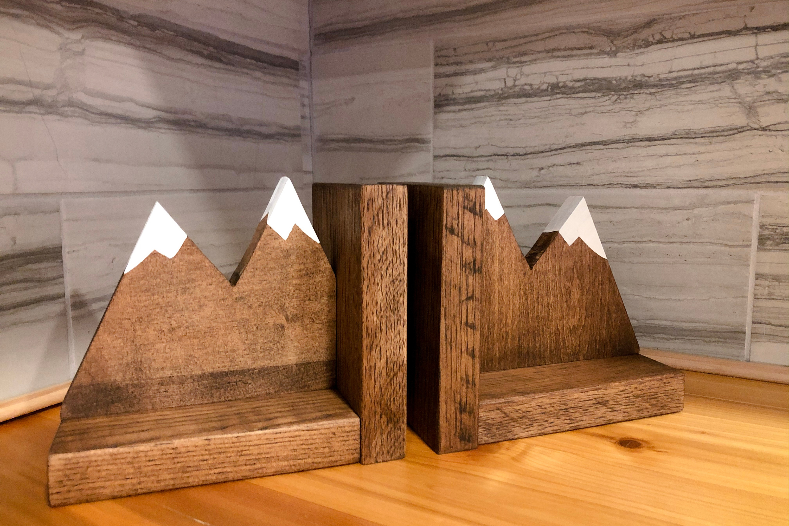 Wooden bookends that look like mountains.
