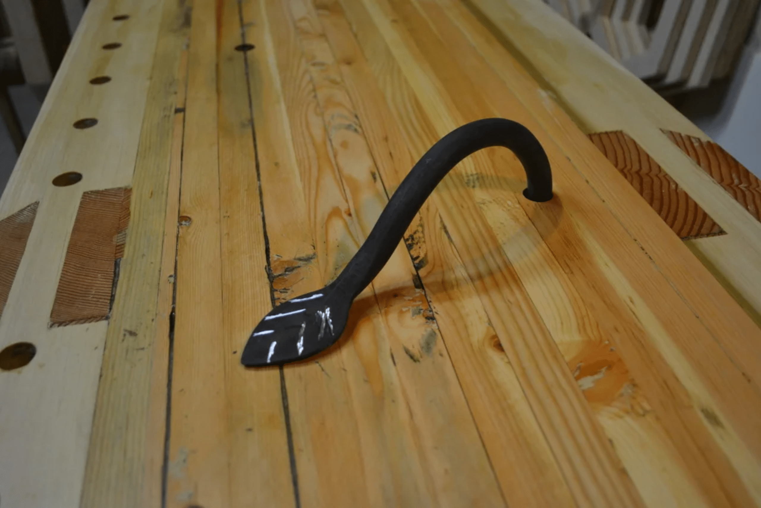 Custom holdfast in a workbench with leaf end.