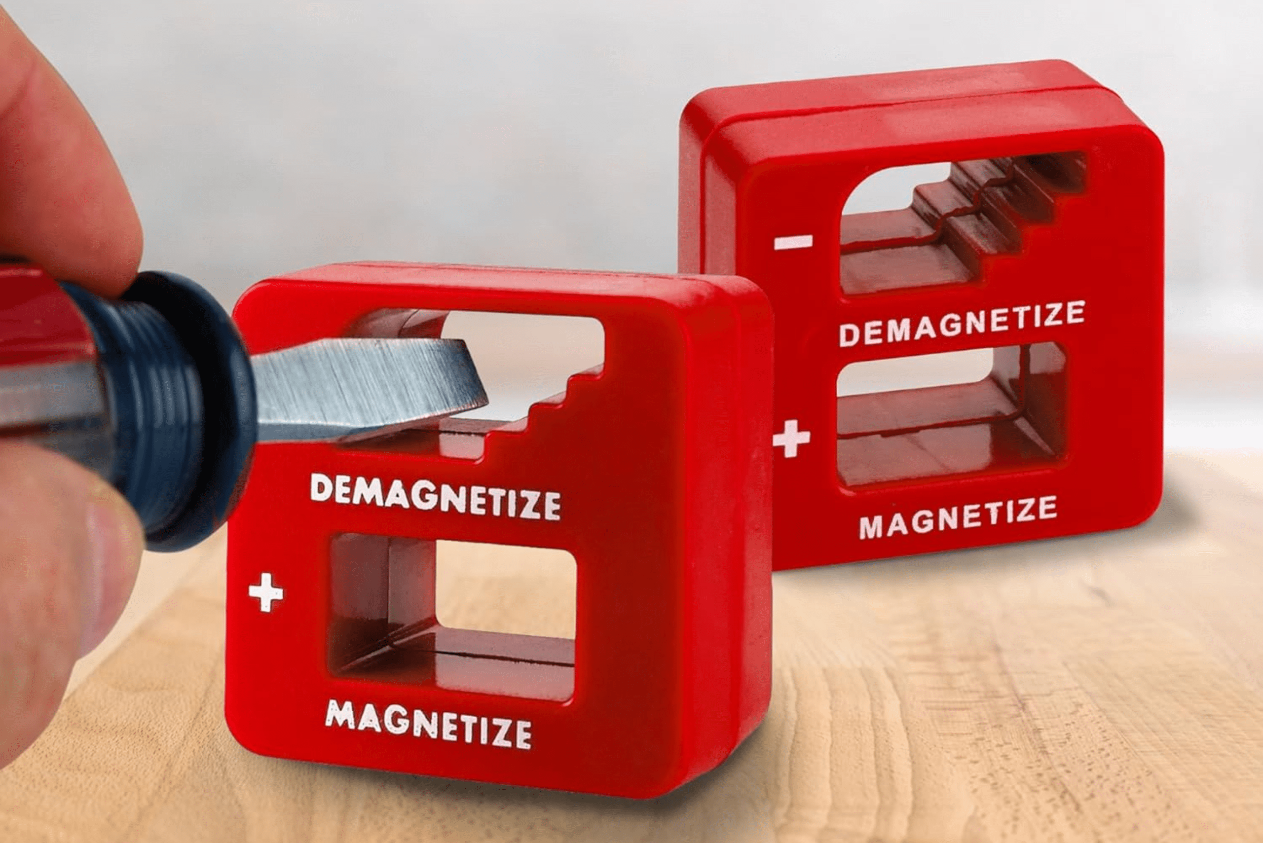 A red magnetizer tool.