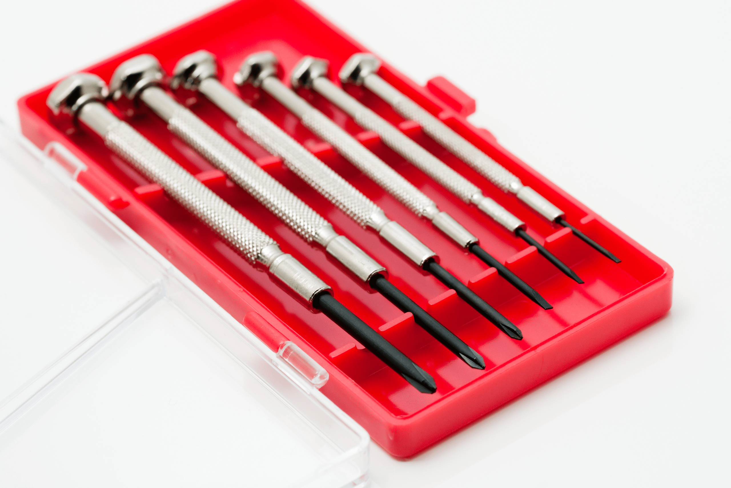 Precision screwdriver set in a red case.