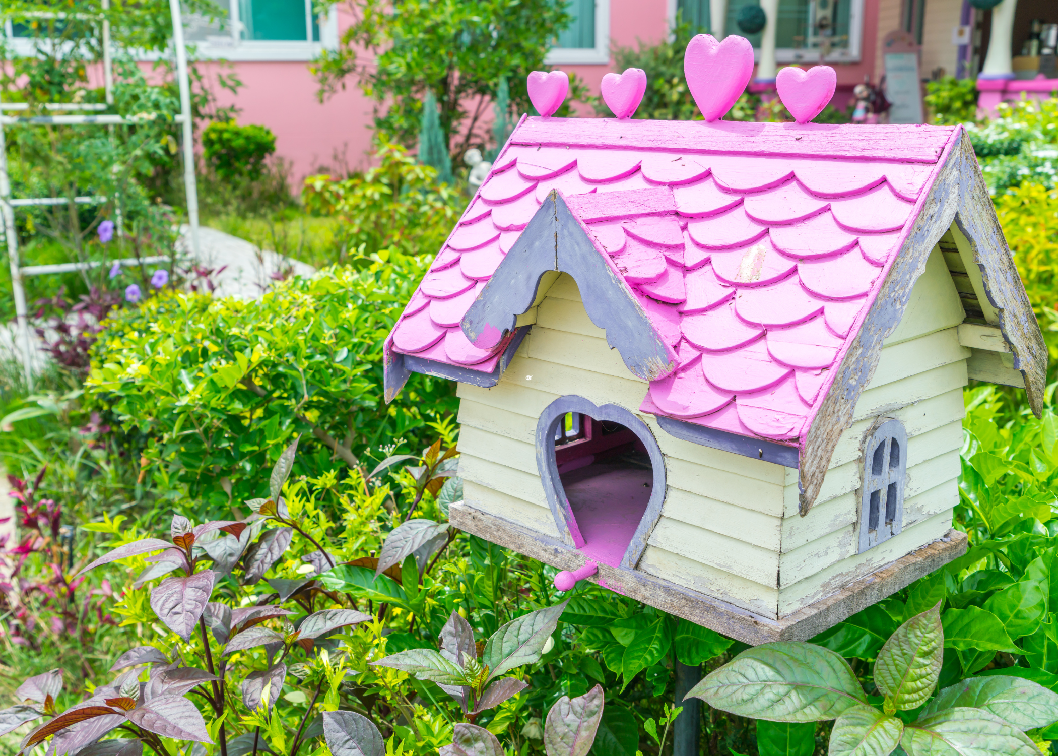 yellow and pink birdhouse
