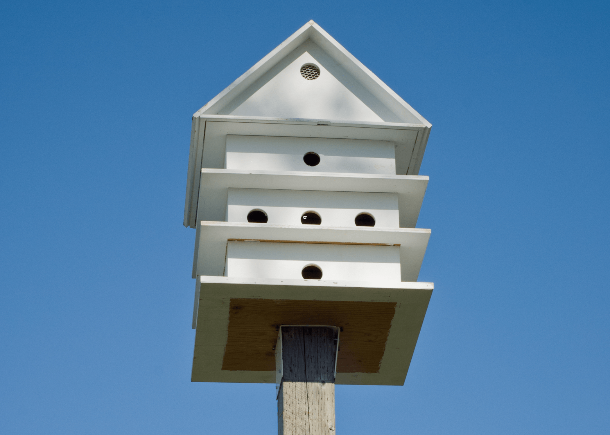 white four story birdhouse