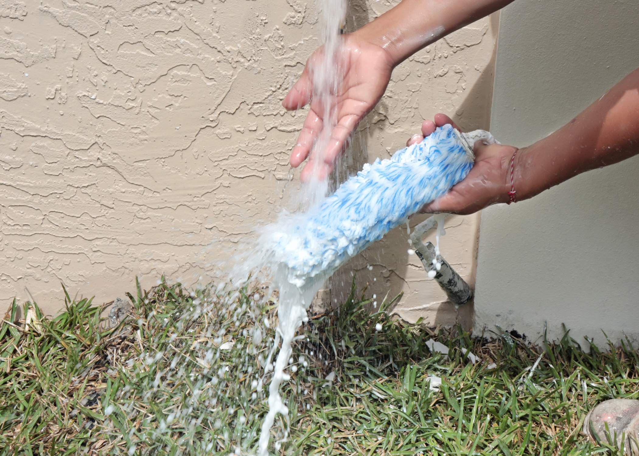 cleaning roller with water outdoors