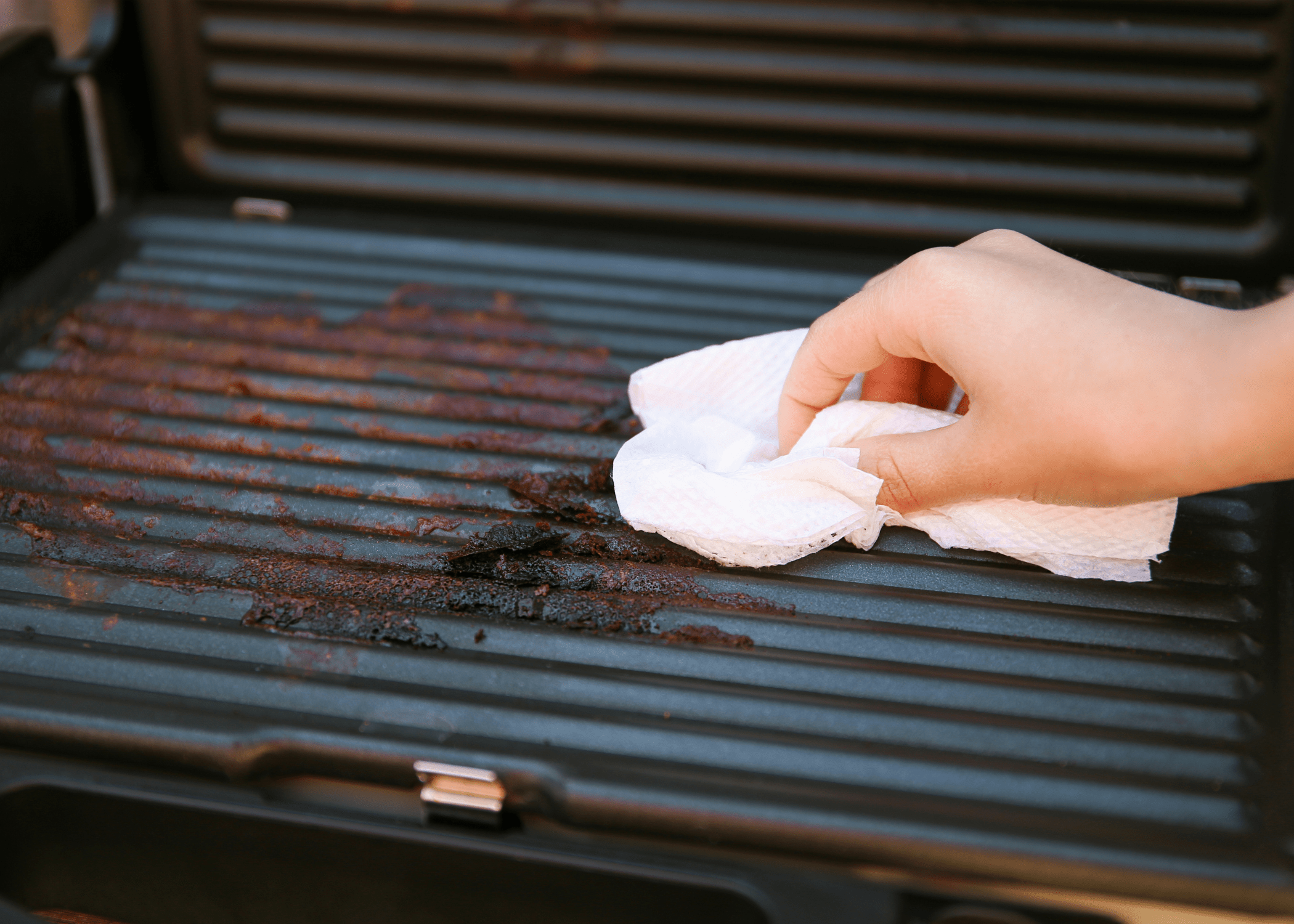 cleaning grill with brush