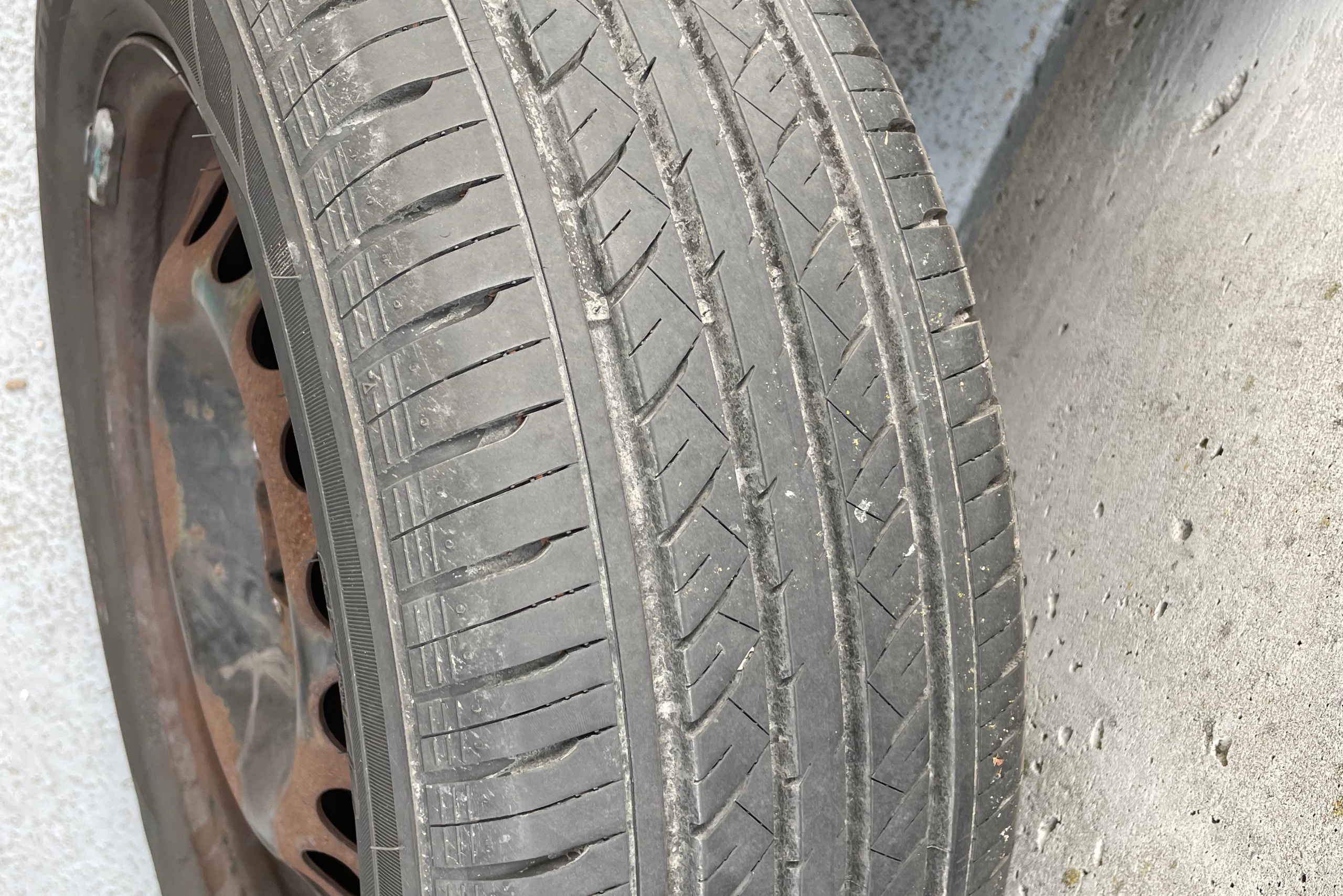 Tire closeup showing tread depth.