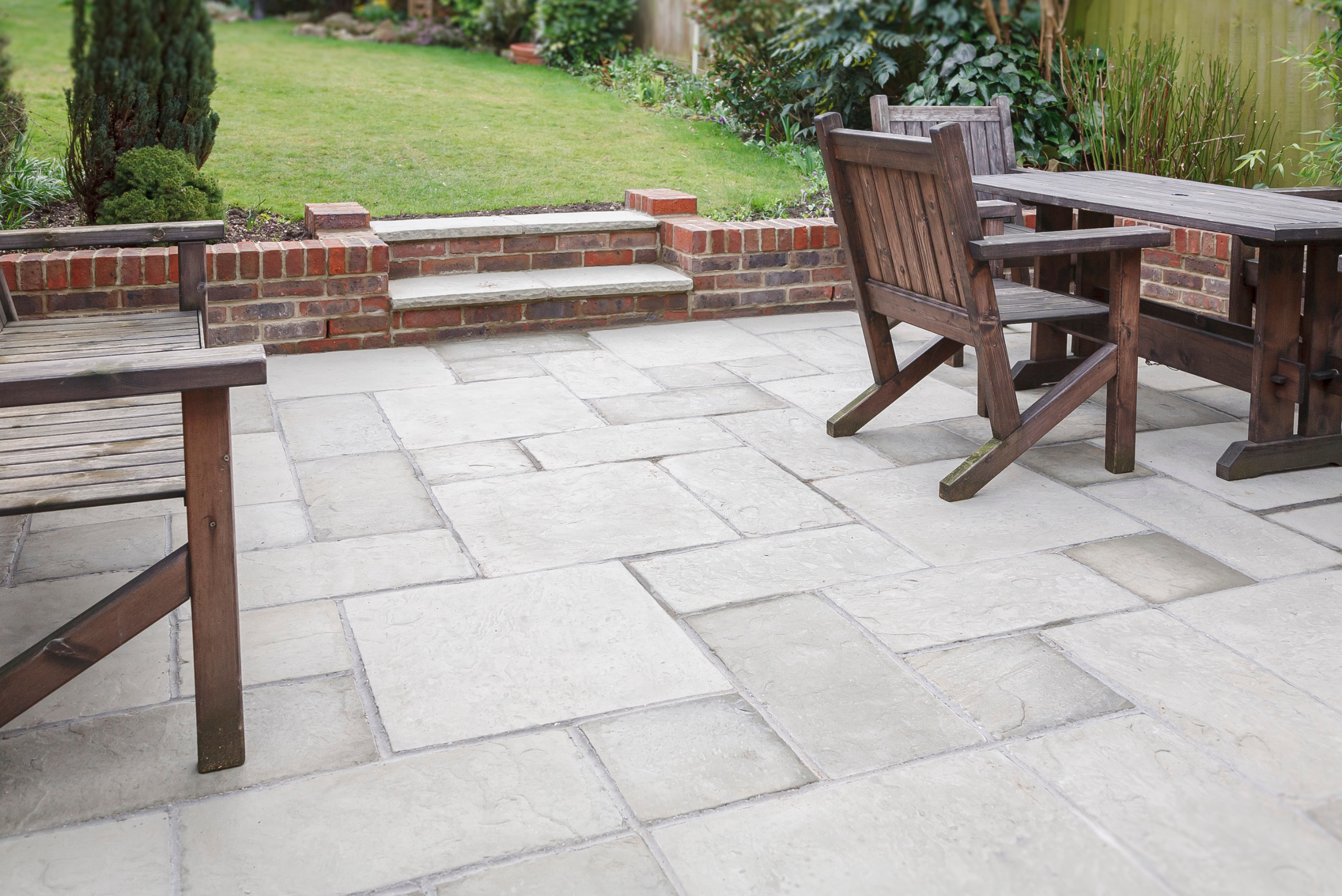 A backyard with clean patio stones.