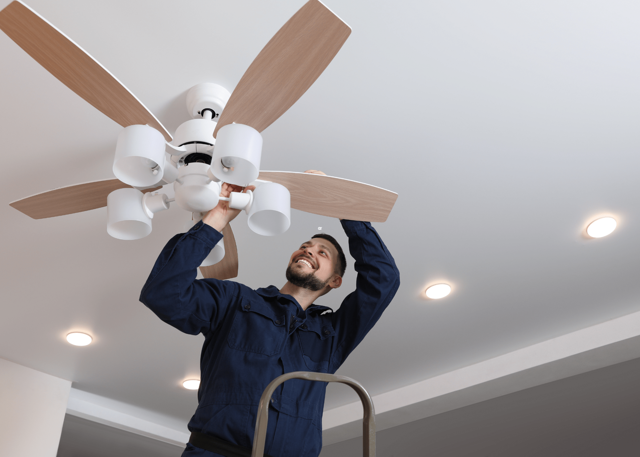 man fixing ceiling fan