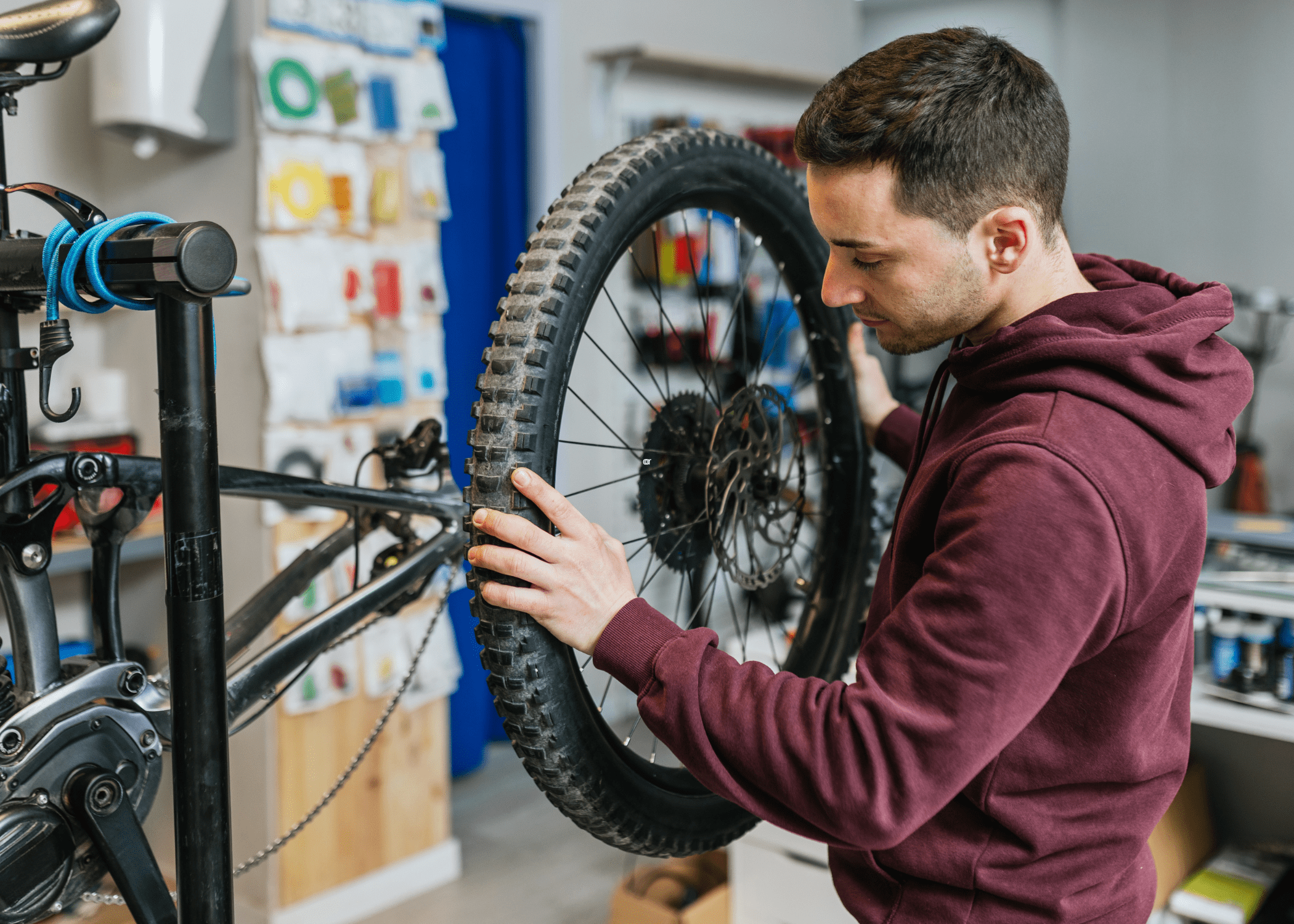 man replacing a bike tire