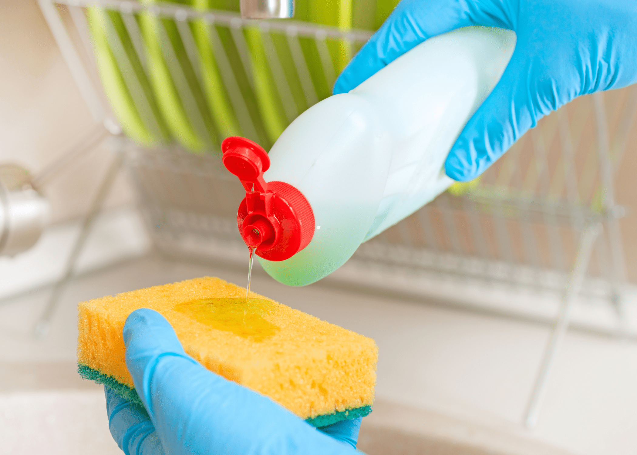 dish soap being poured on a sponge