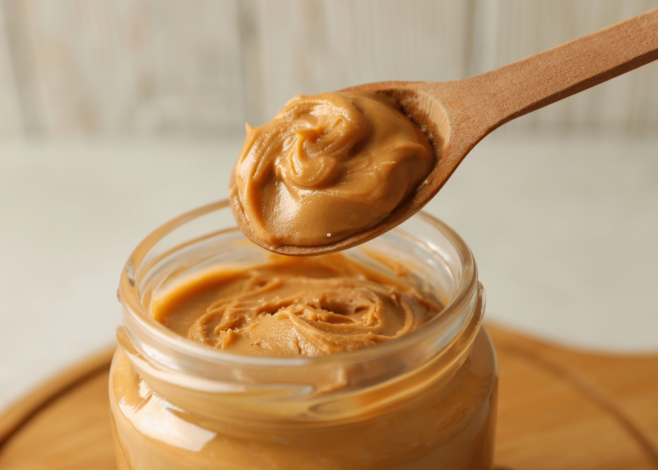 close up of spoon with peanut butter