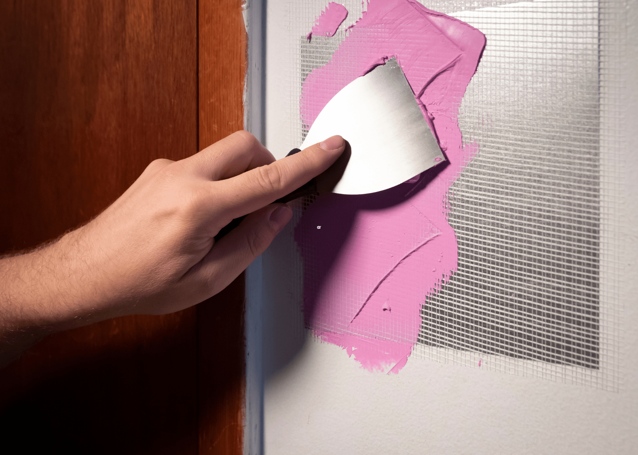 repairing hole in drywall with pink putty