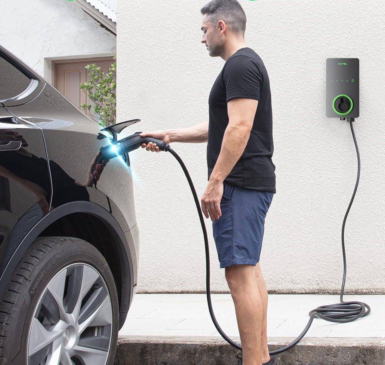 man charging an electric car
