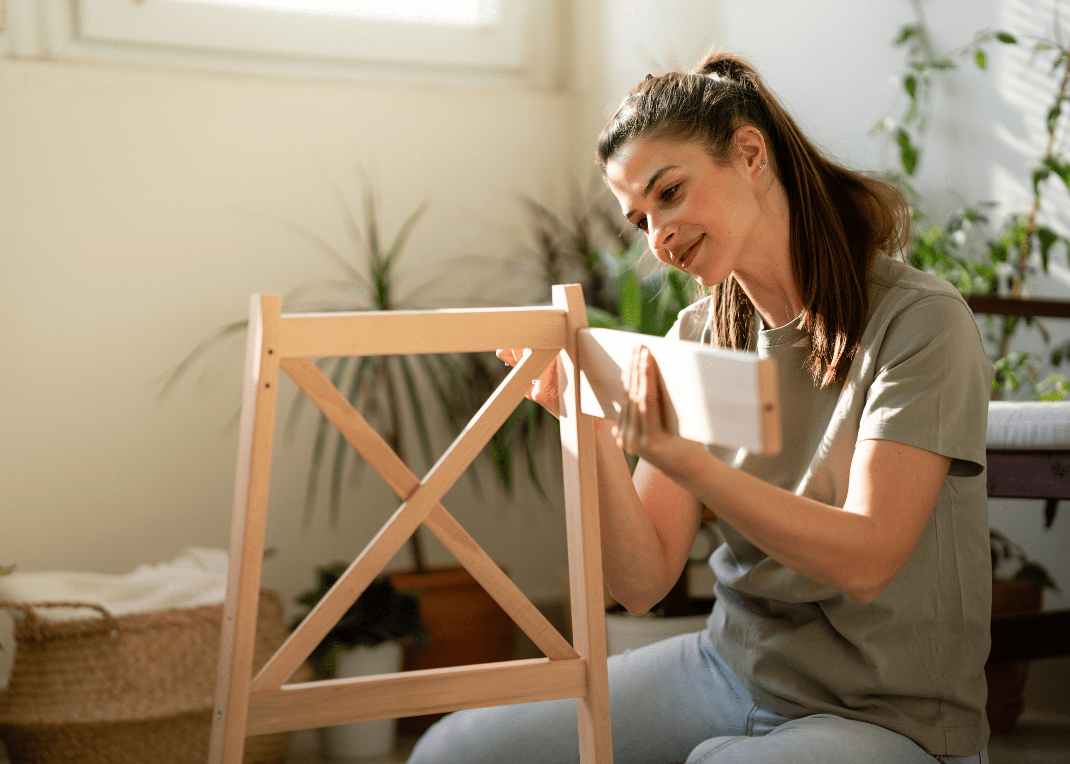 woman putting together a piece of furniture