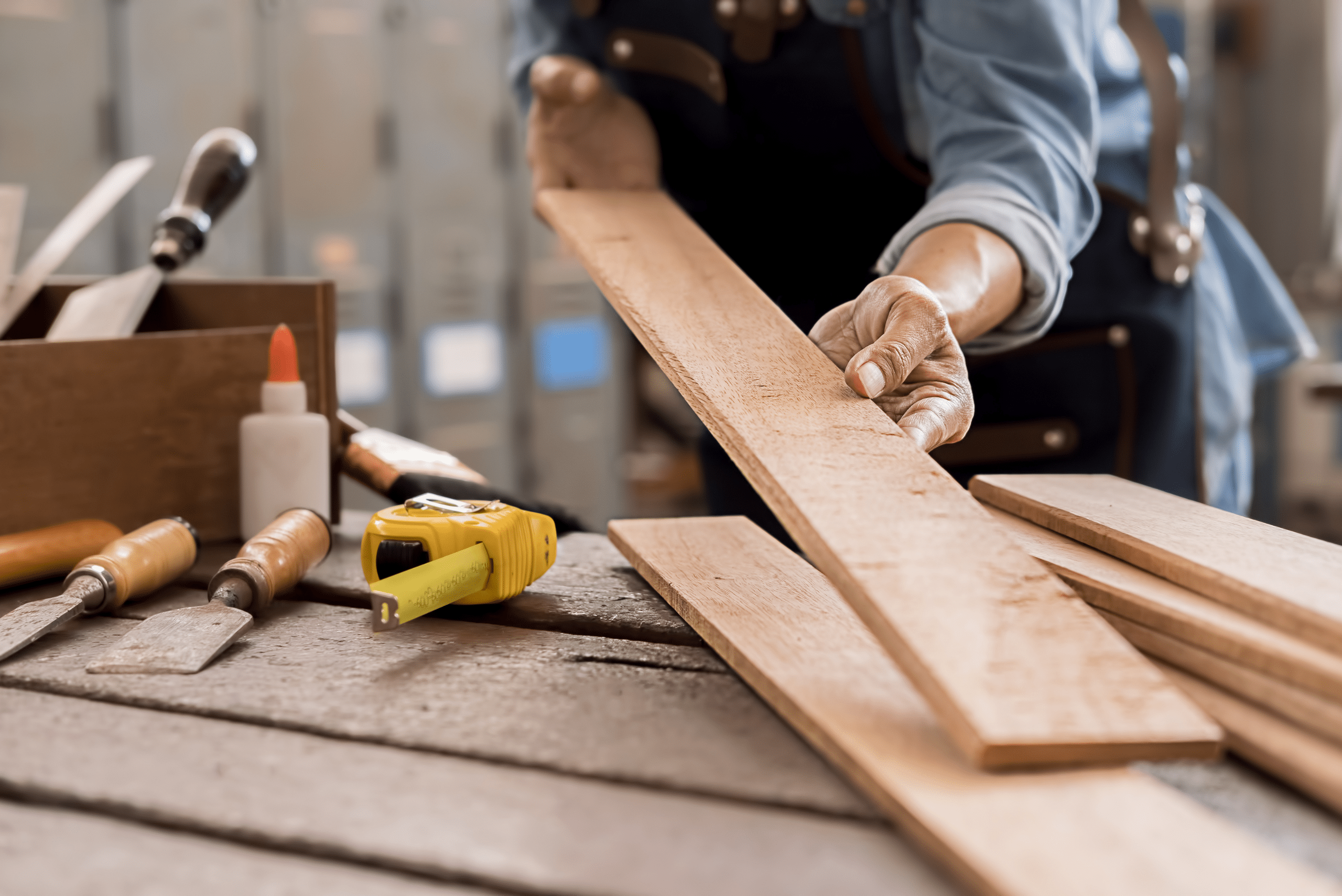 A person holding a wooden board.