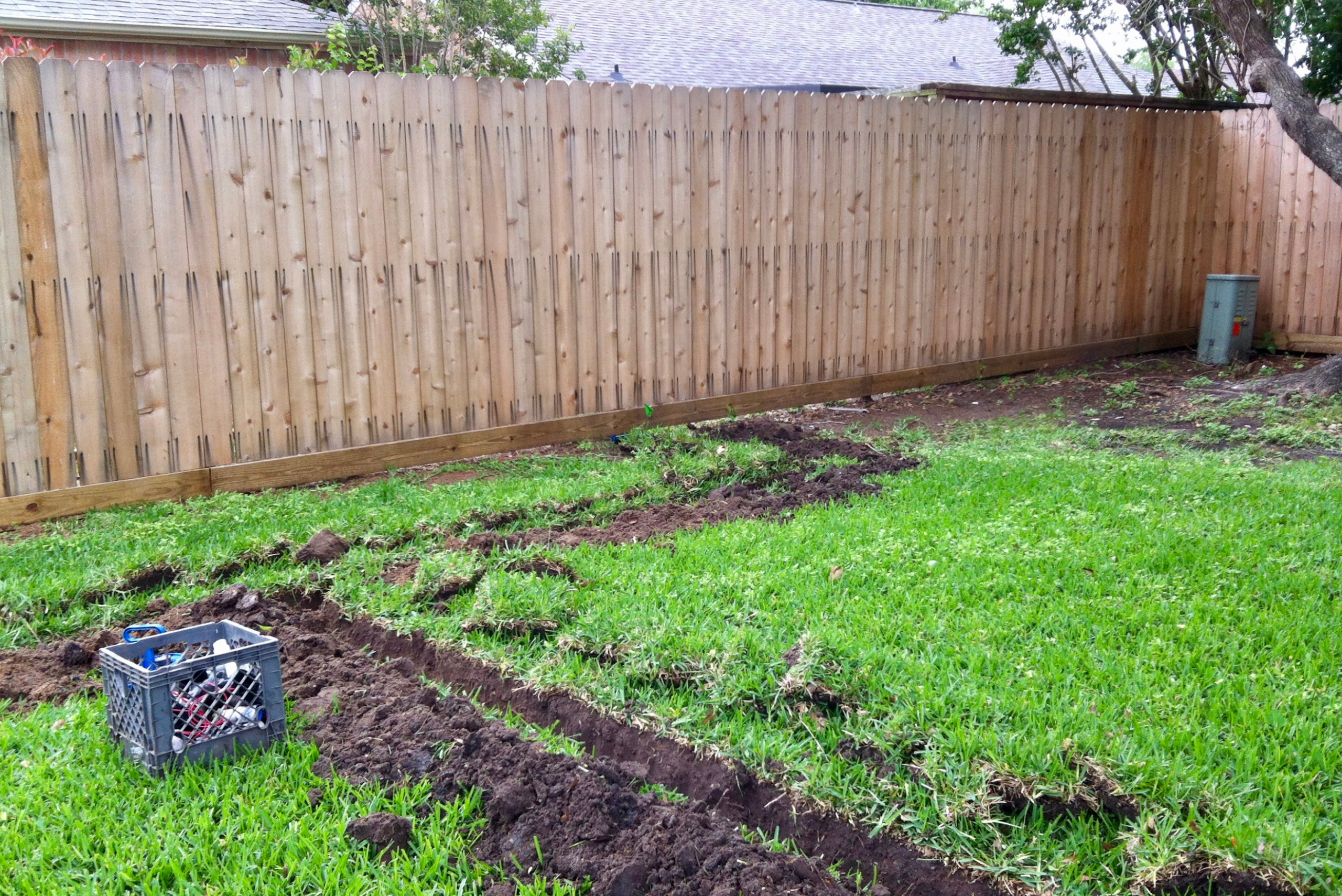 Dug up trenches for a sprinkler system.