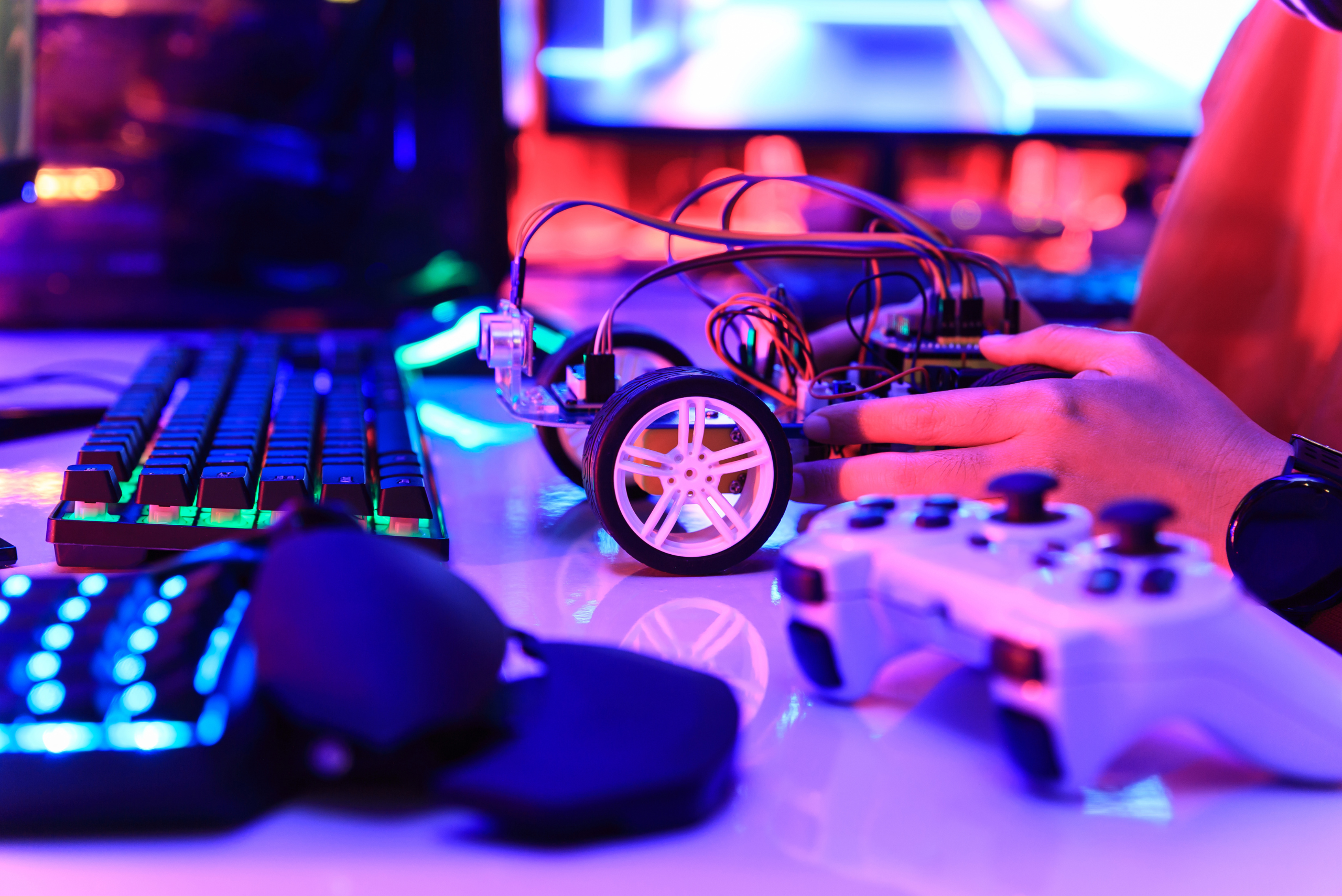 Arduino RC car in purple lit room.