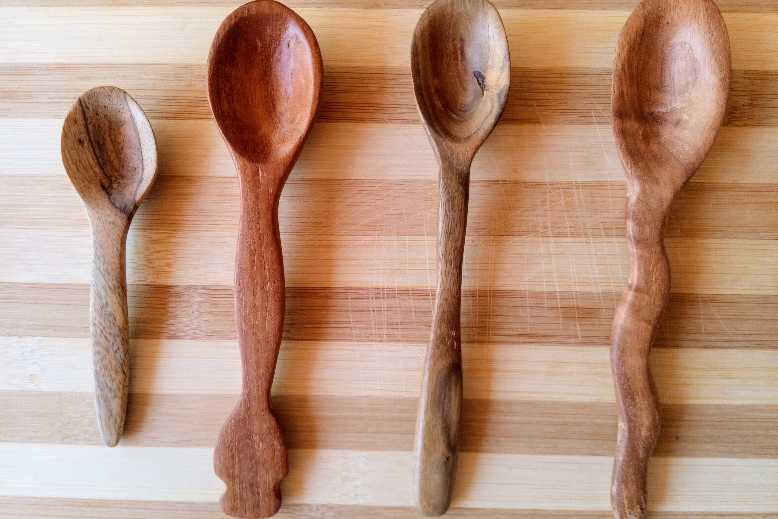 Four wooden spoons.