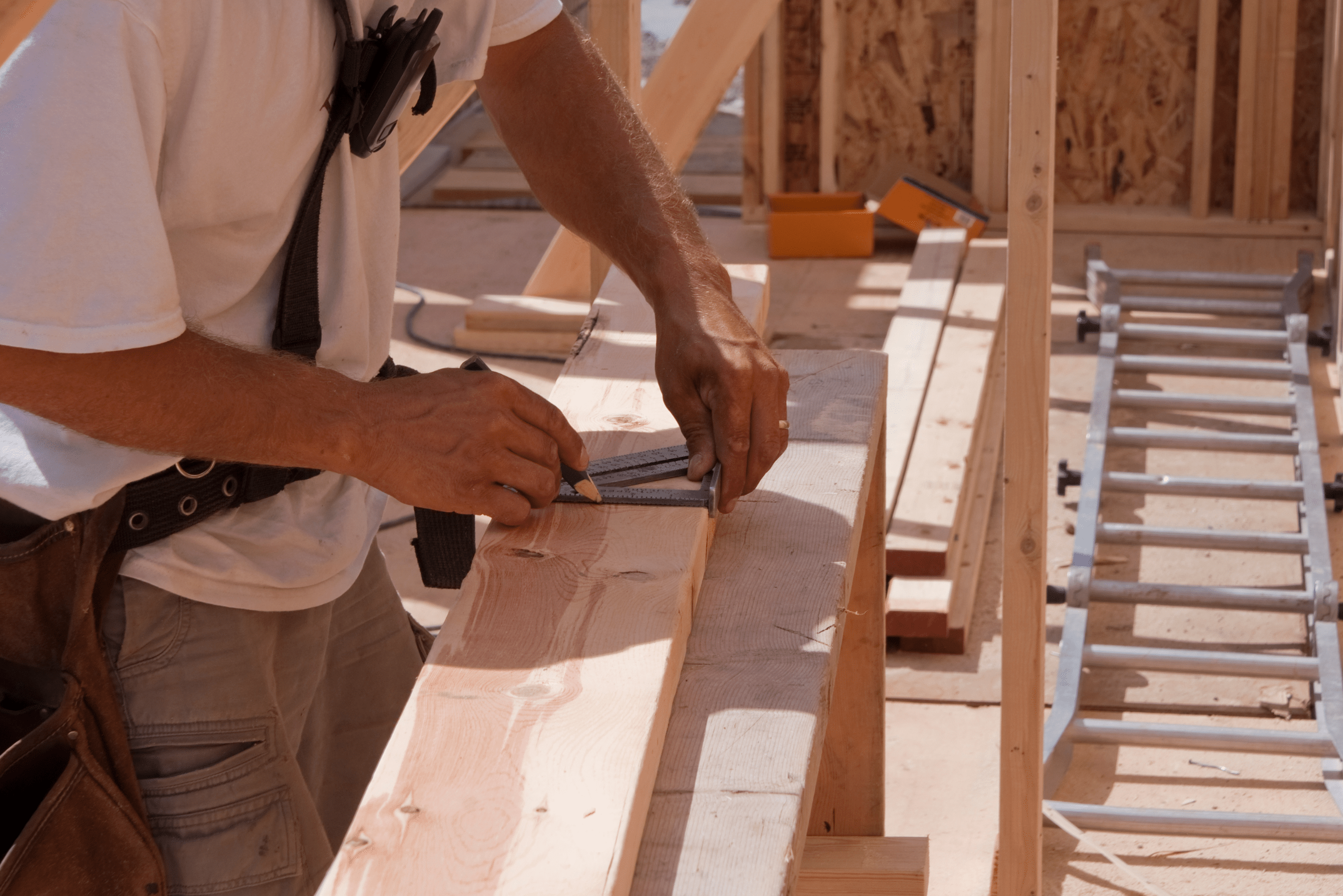 Measuring a wooden 2x4 board.