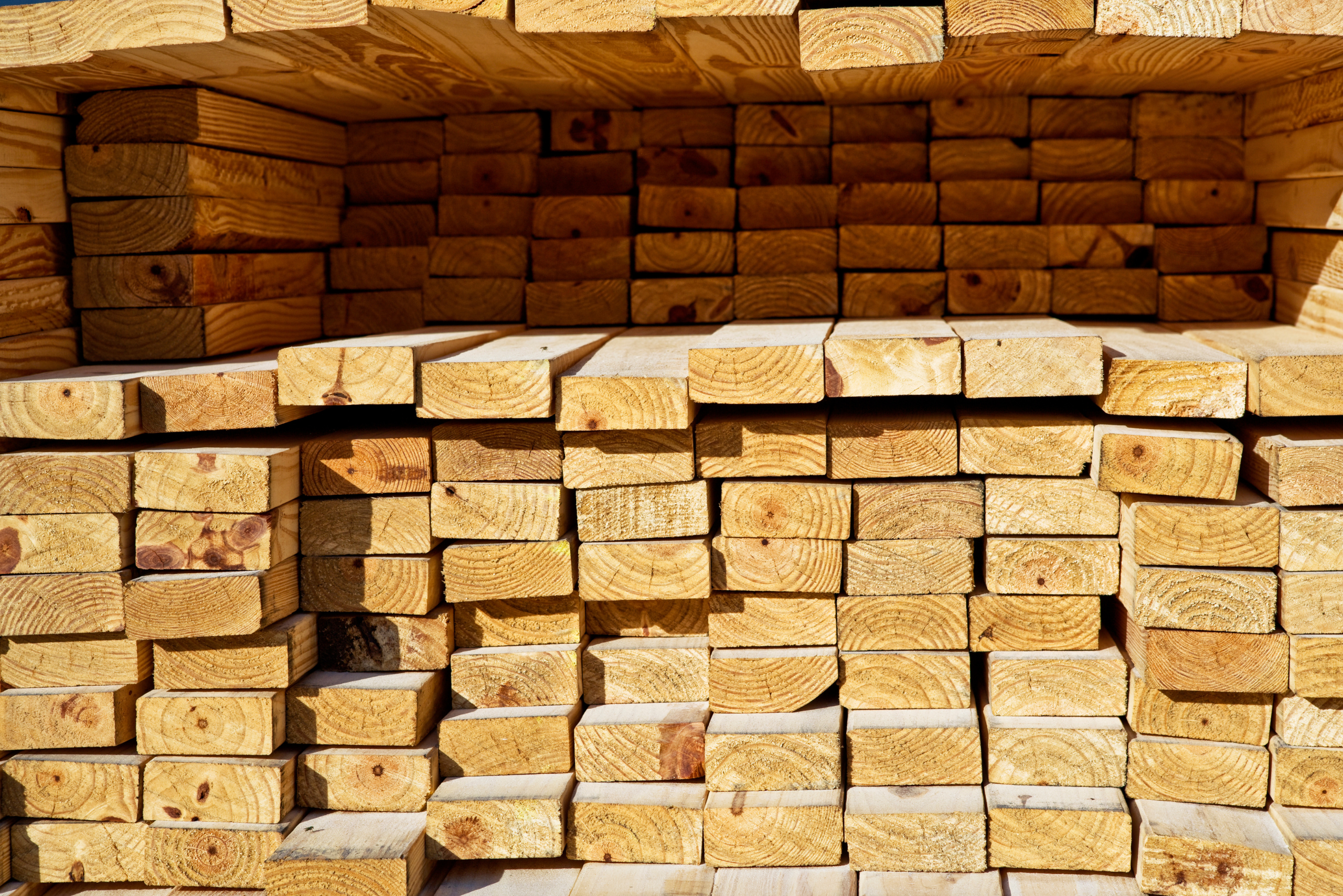 A stack of 2x4 wood boards.