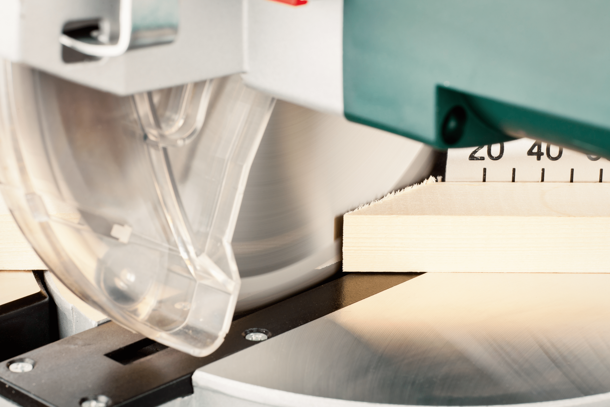 A miter saw cutting a miter joint.