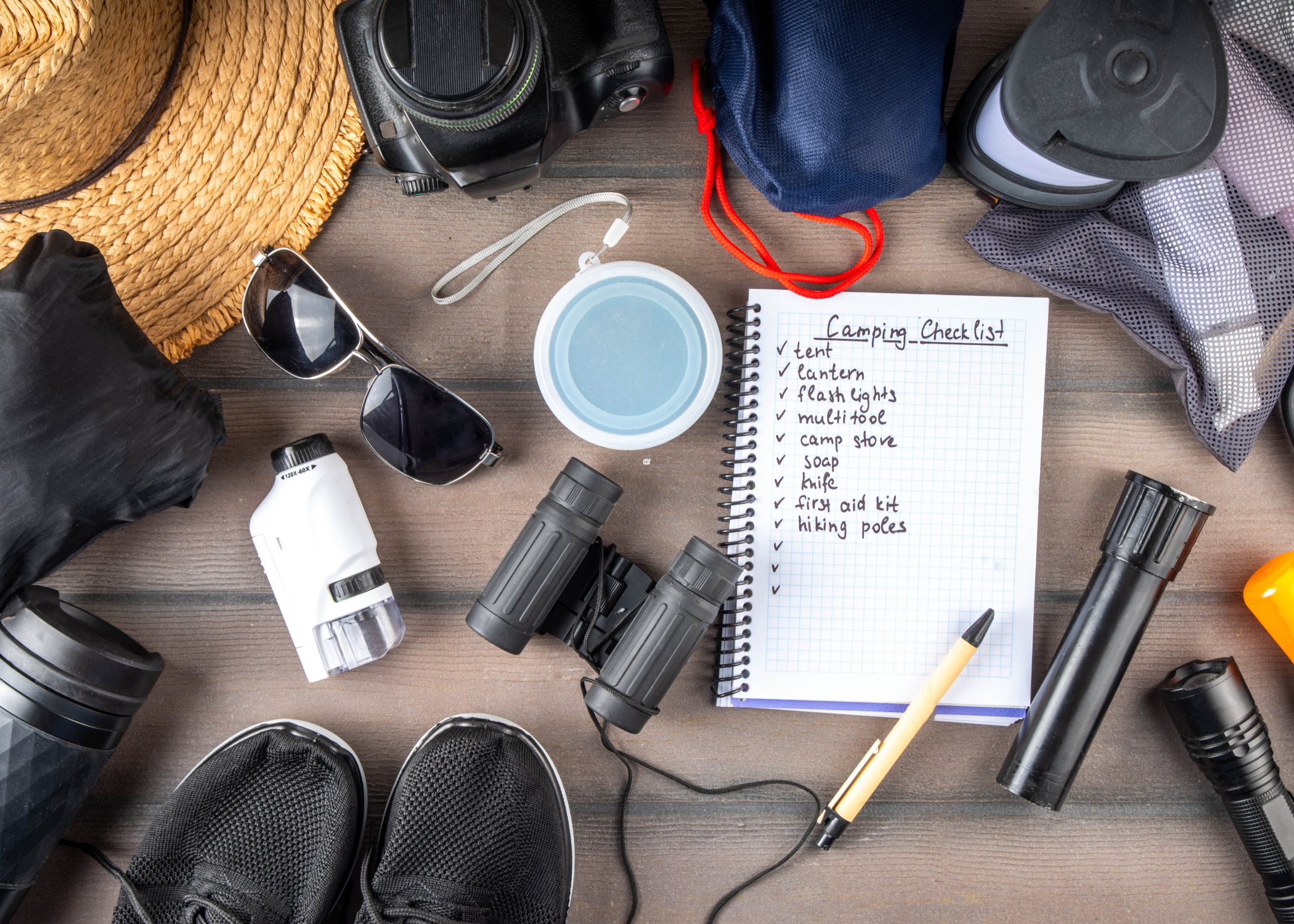 camping checklist and flat lay of camping supplies