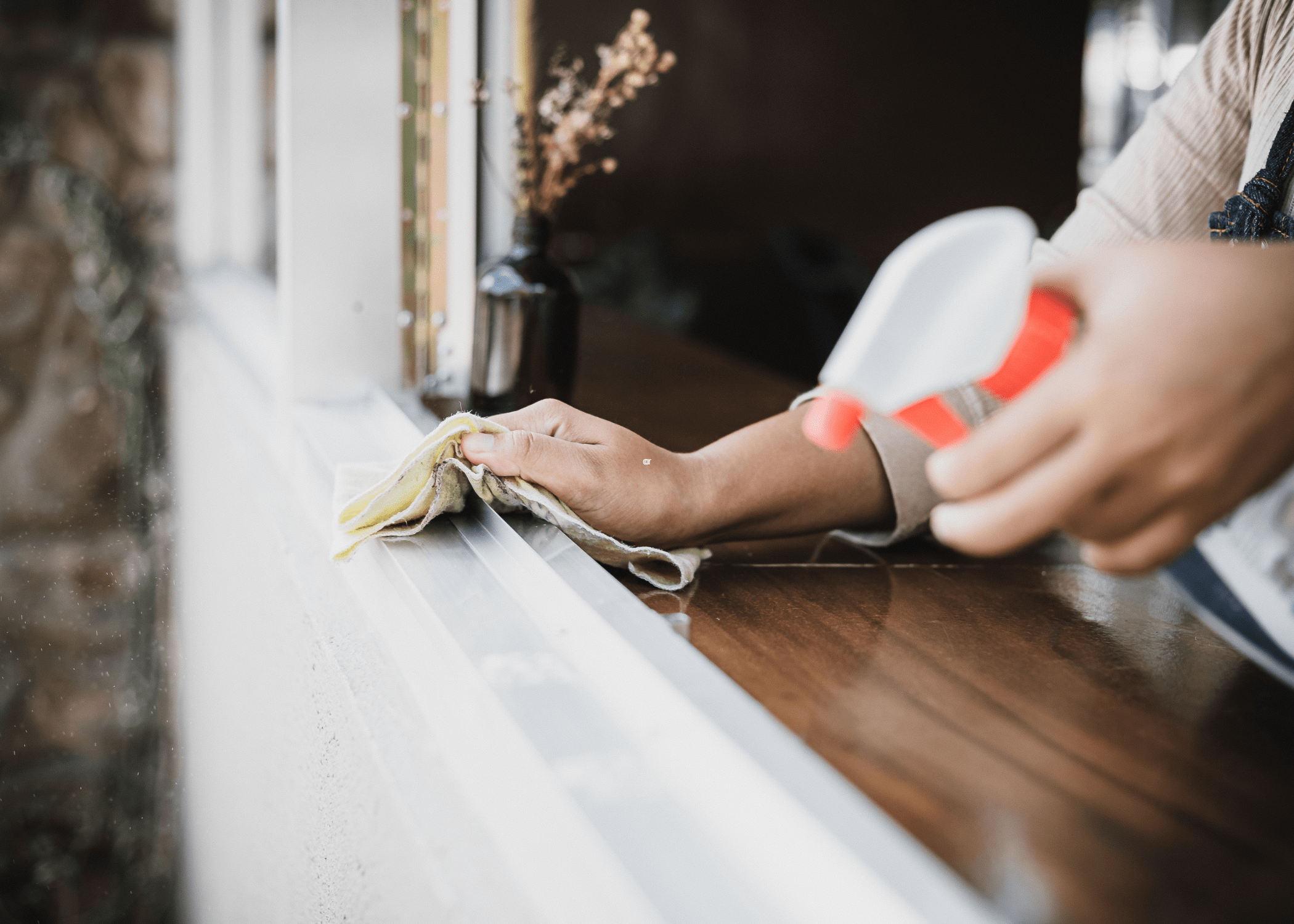 cleaning a window sill