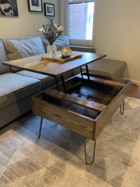 lift top coffee table stained in walnut extended in living room