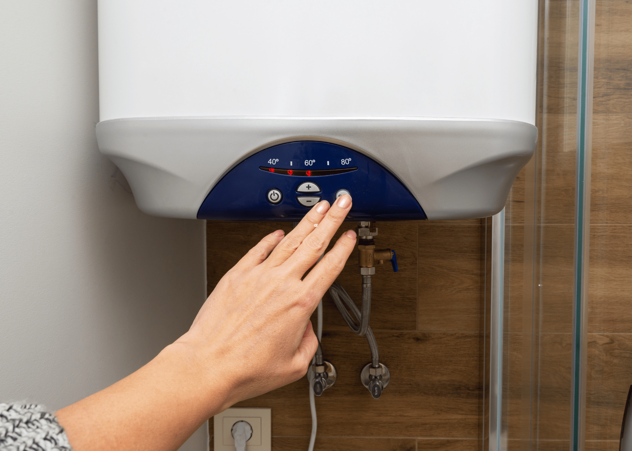 pushing a button on a tankless hot water heater