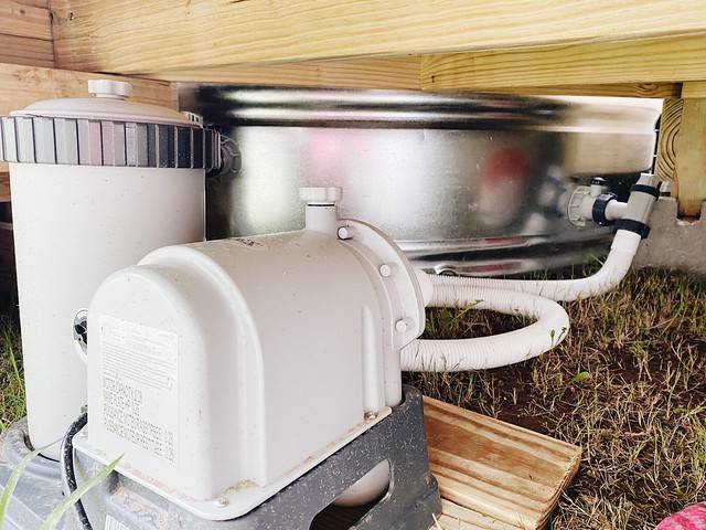 water filtration system under a stock tank pool