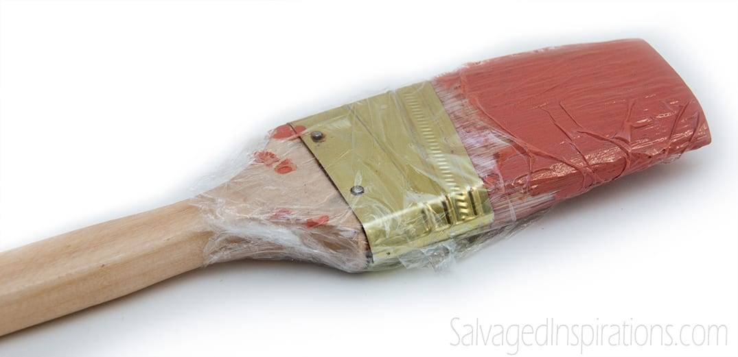 plastic wrap wrapped around a paintbrush