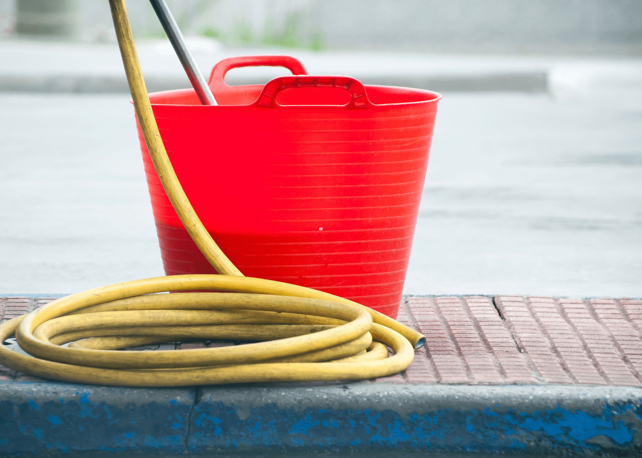 red bucket and hose