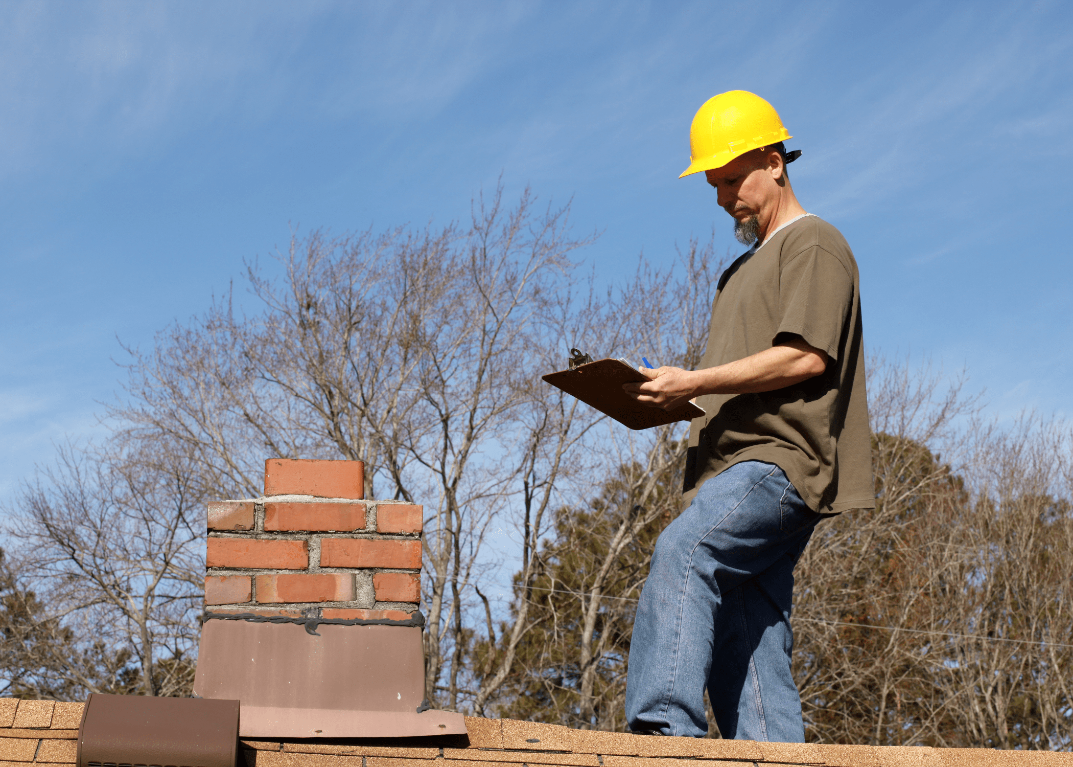 man looking at a chimney