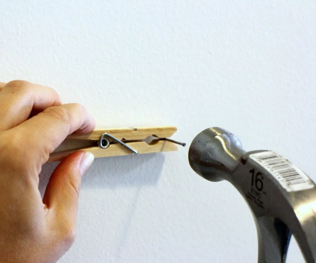 using a clothespin to hold a nail while hammering