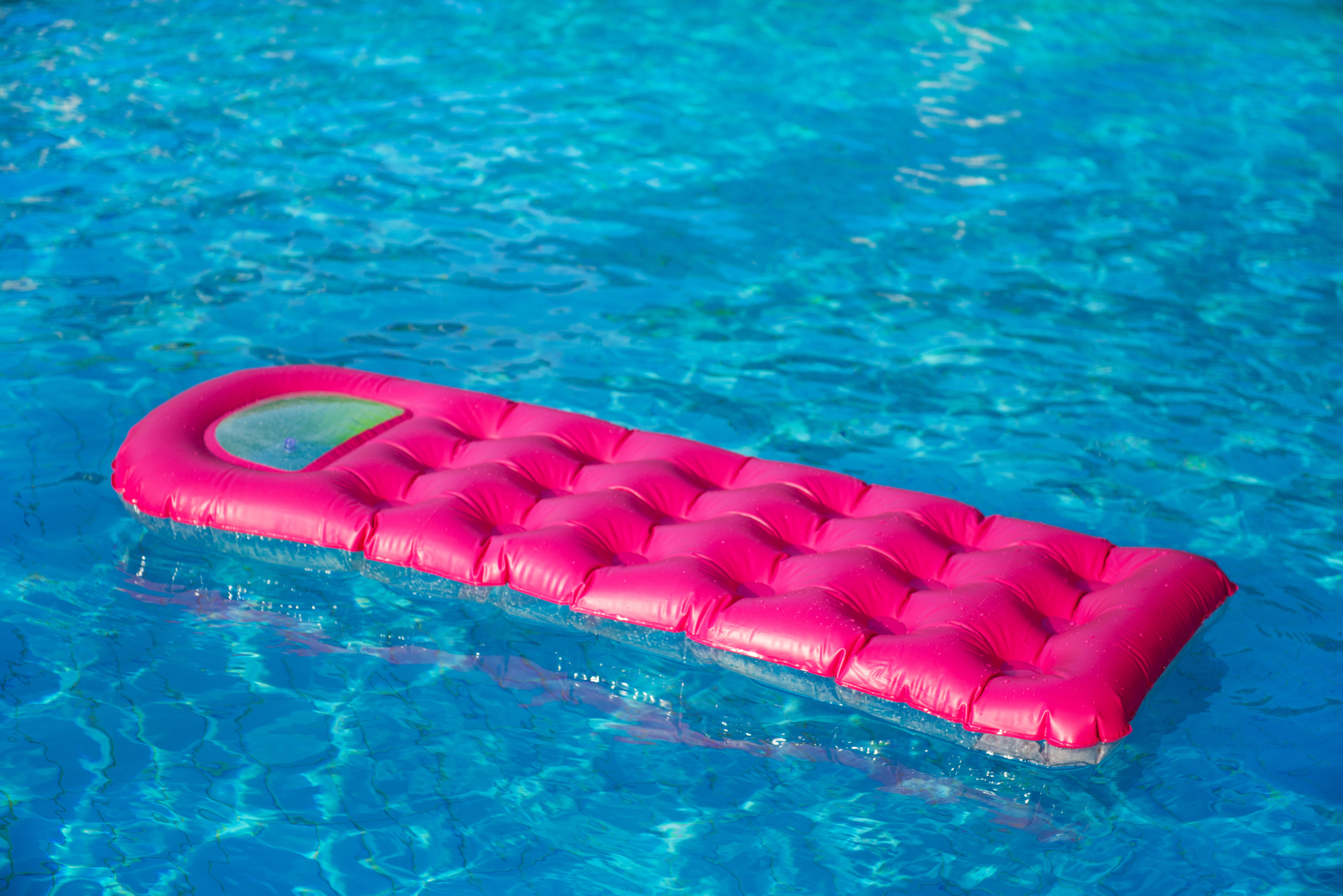 Floating inflatable mat in a pool.