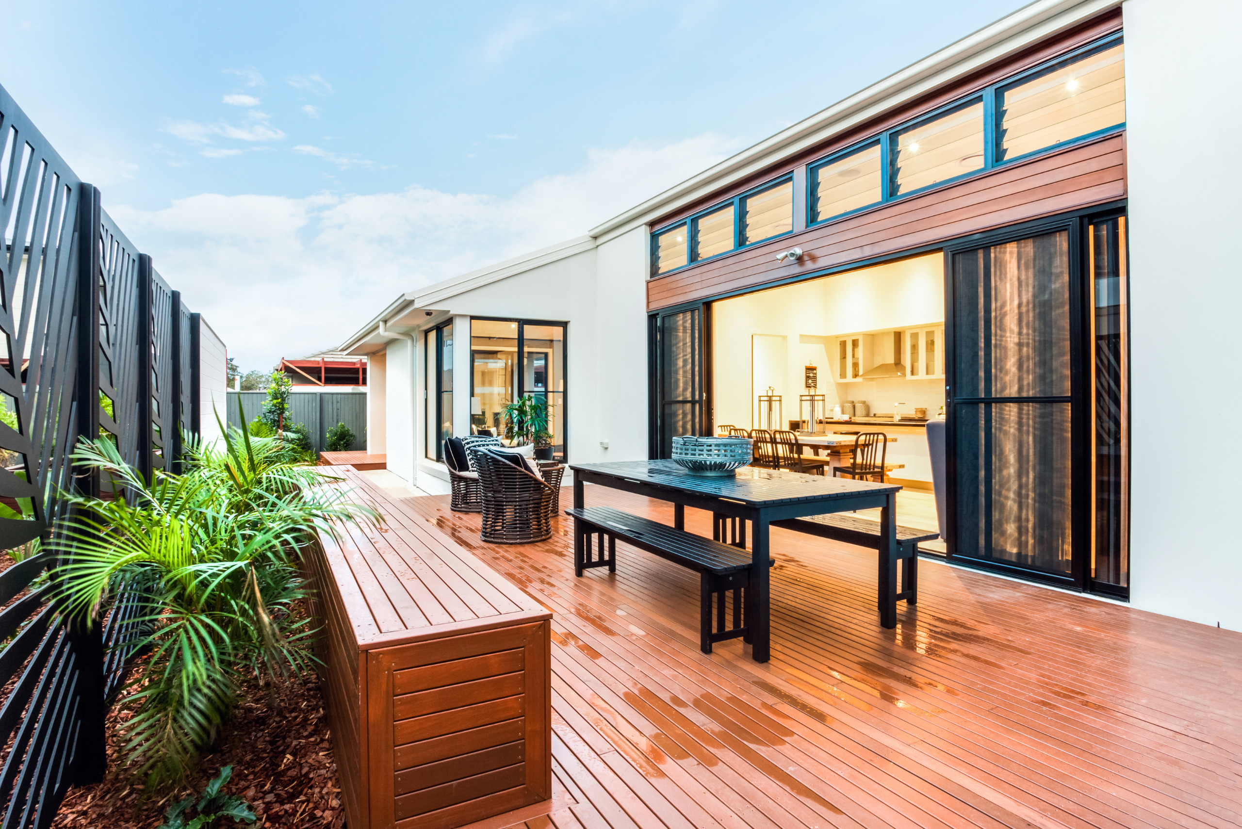 Wet home deck with furniture.