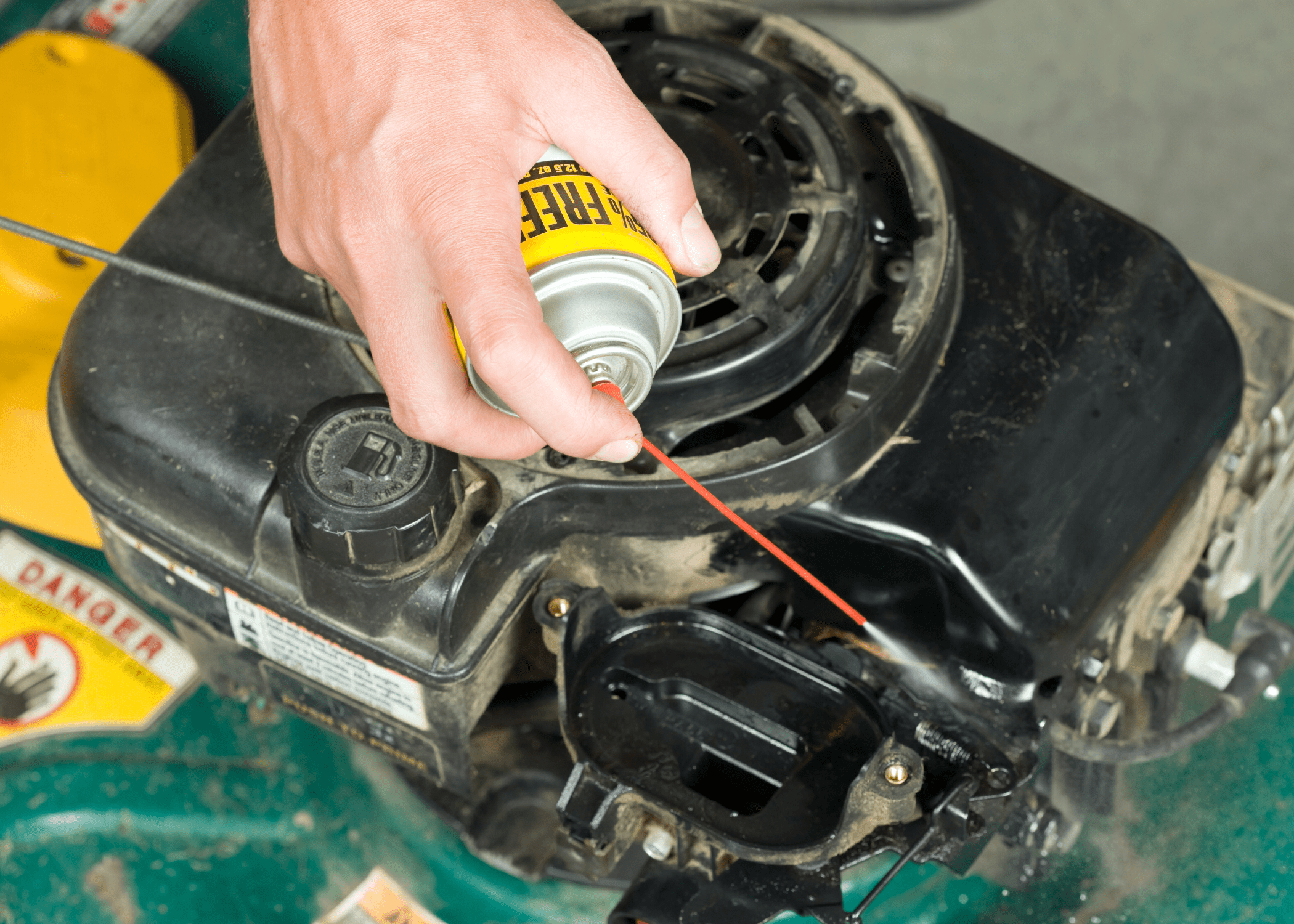 spraying into a lawnmower