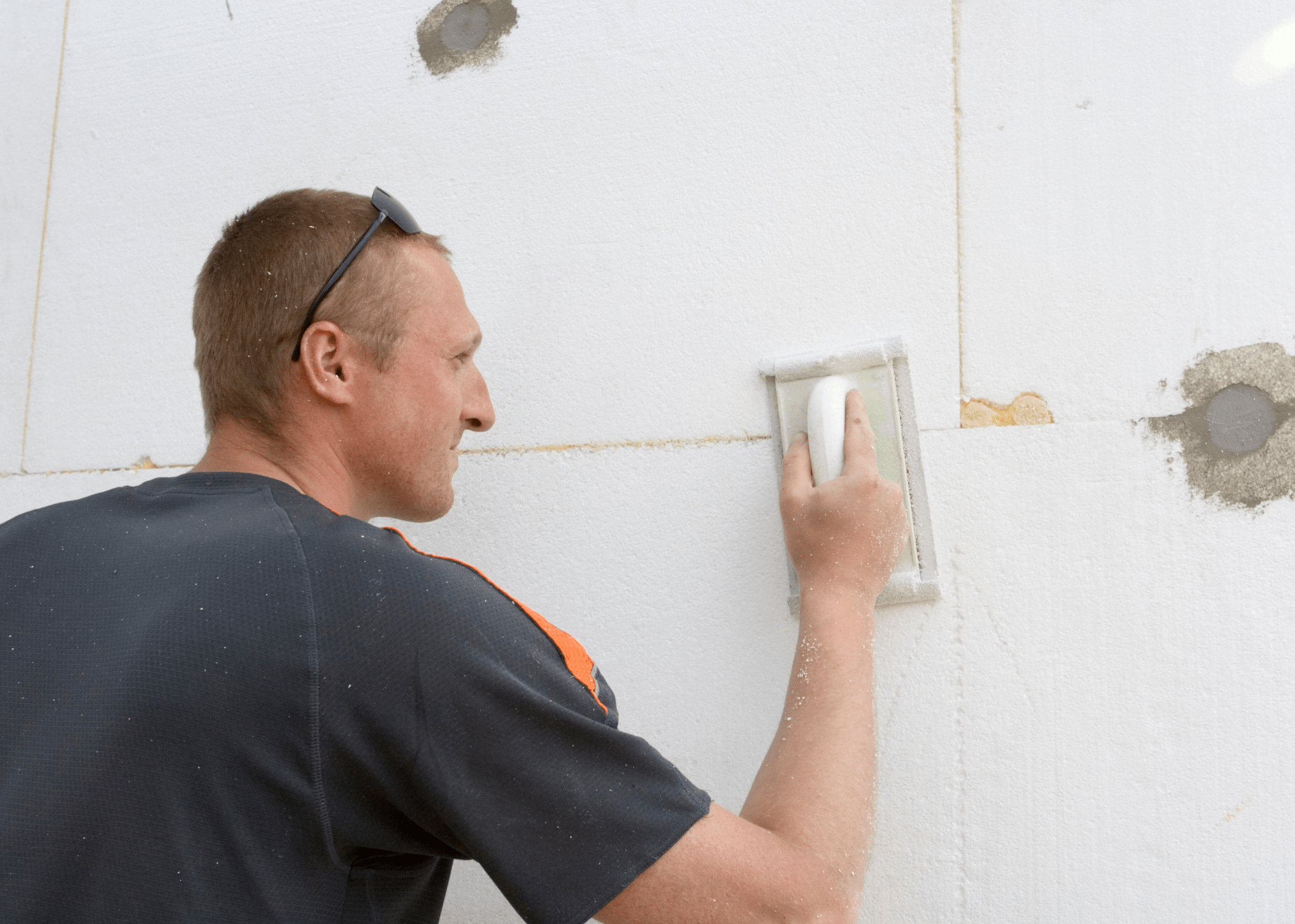 smoothing wall with sandpaper.