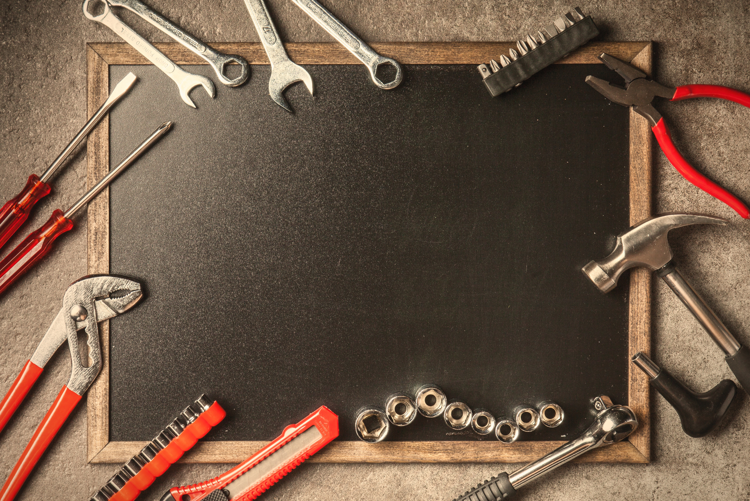 Message board with tools surrounding it.