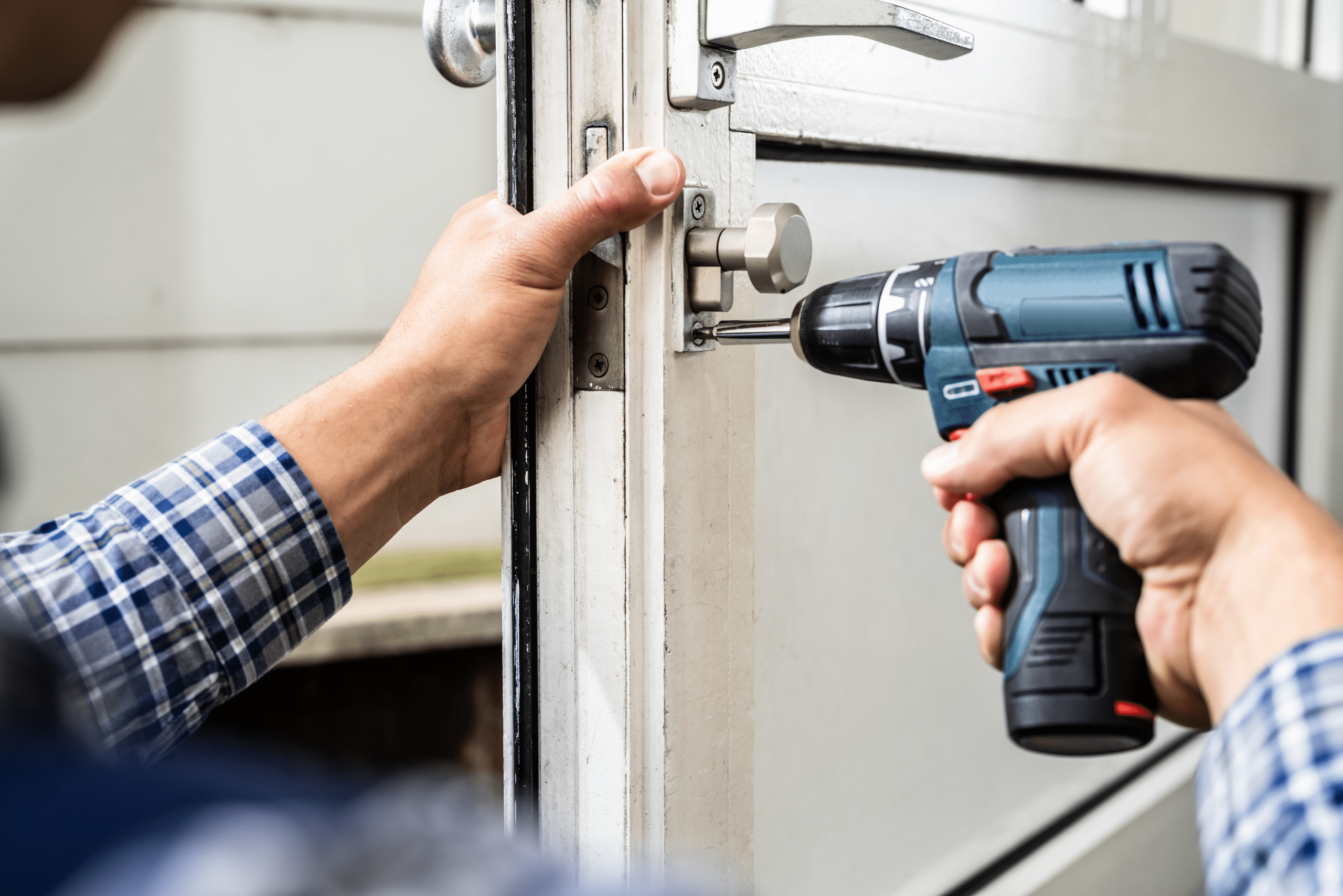 Man installing garage door lock.