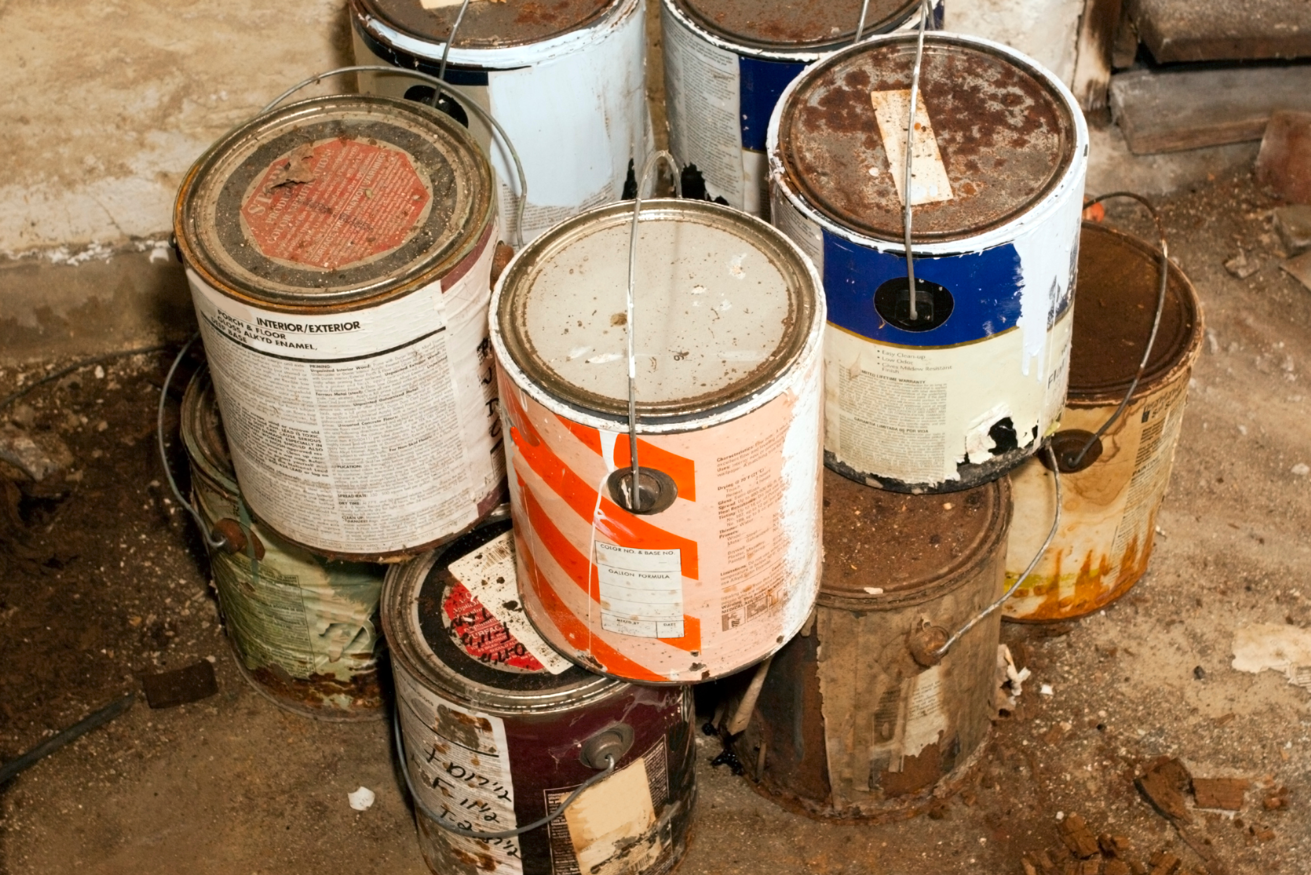 Stack of old paint cans.