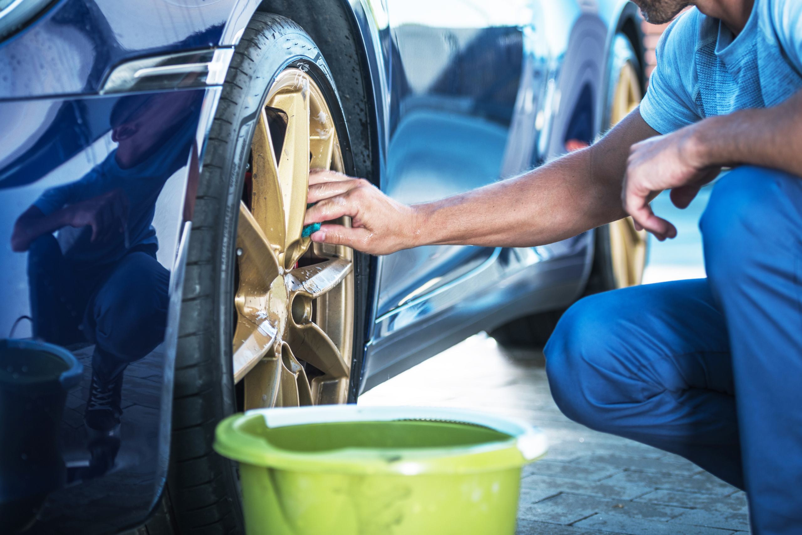 Car wheel being cleaned.