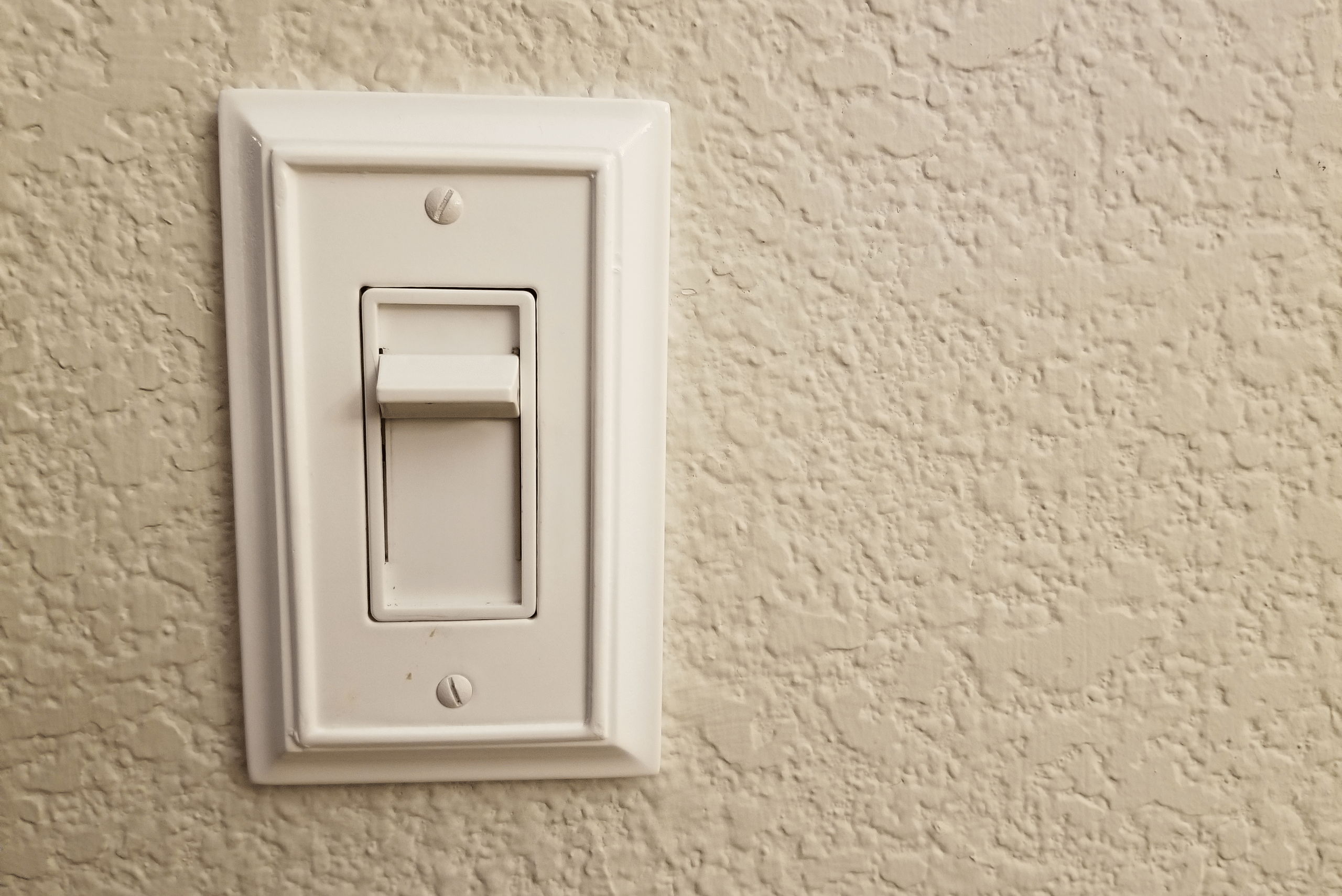 White switch with dimming slide.