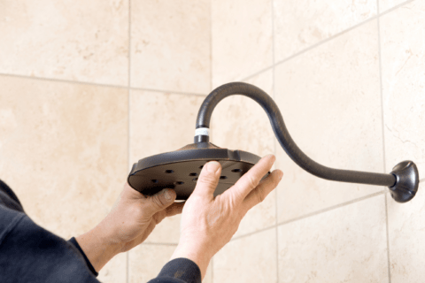 Installing shower head.