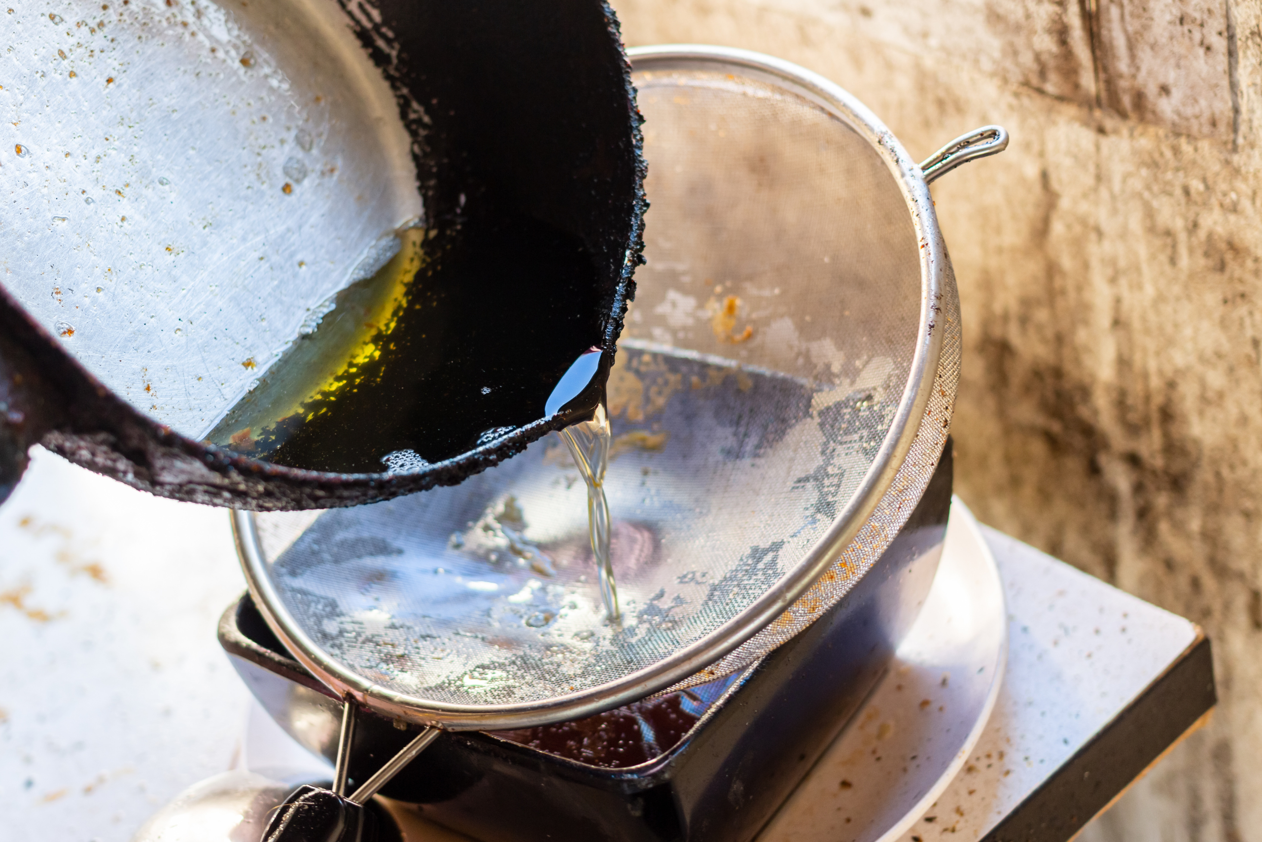 Draining cooking oil.