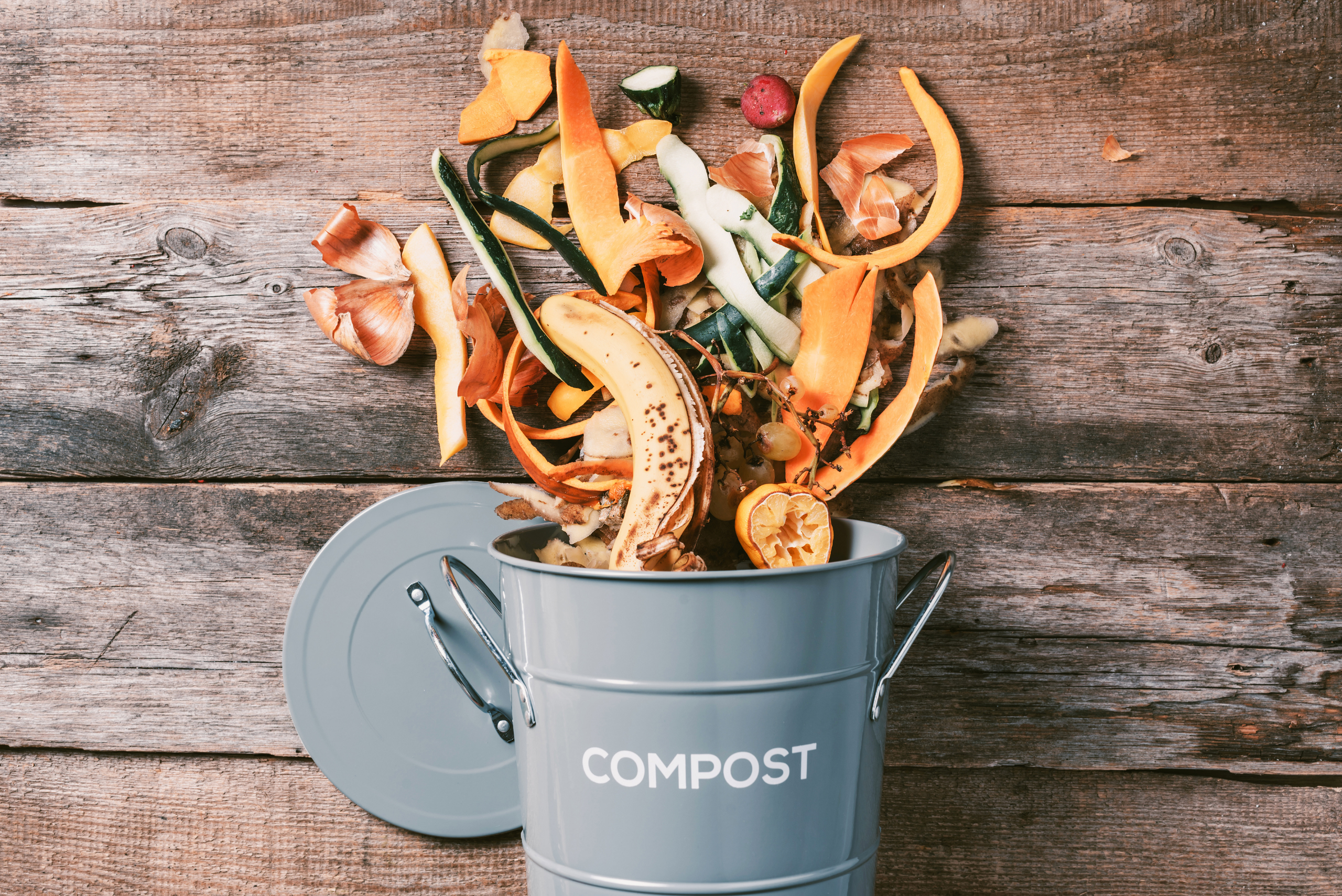 Compost bin with waste spilling out.