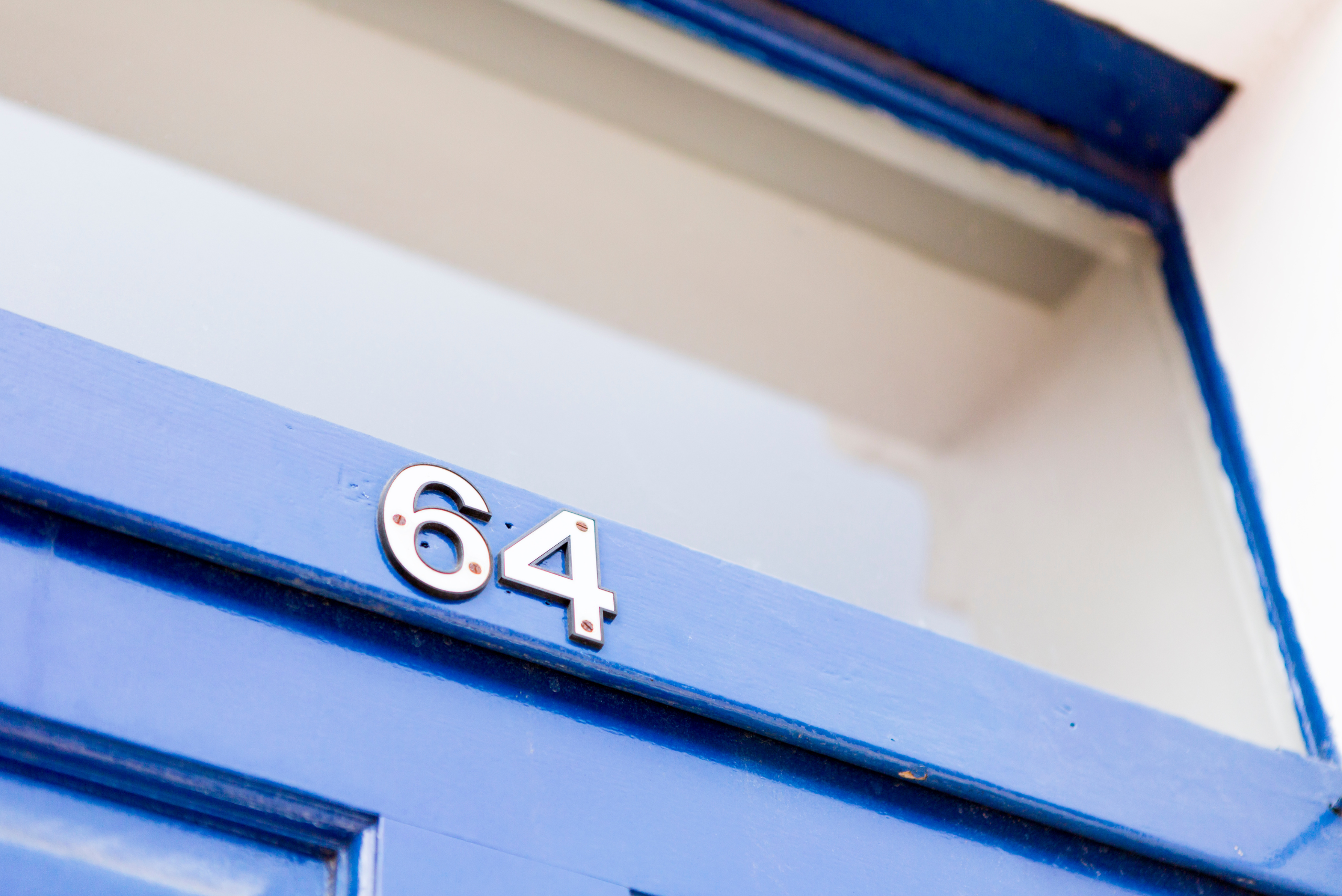 House numbers on a blue door.