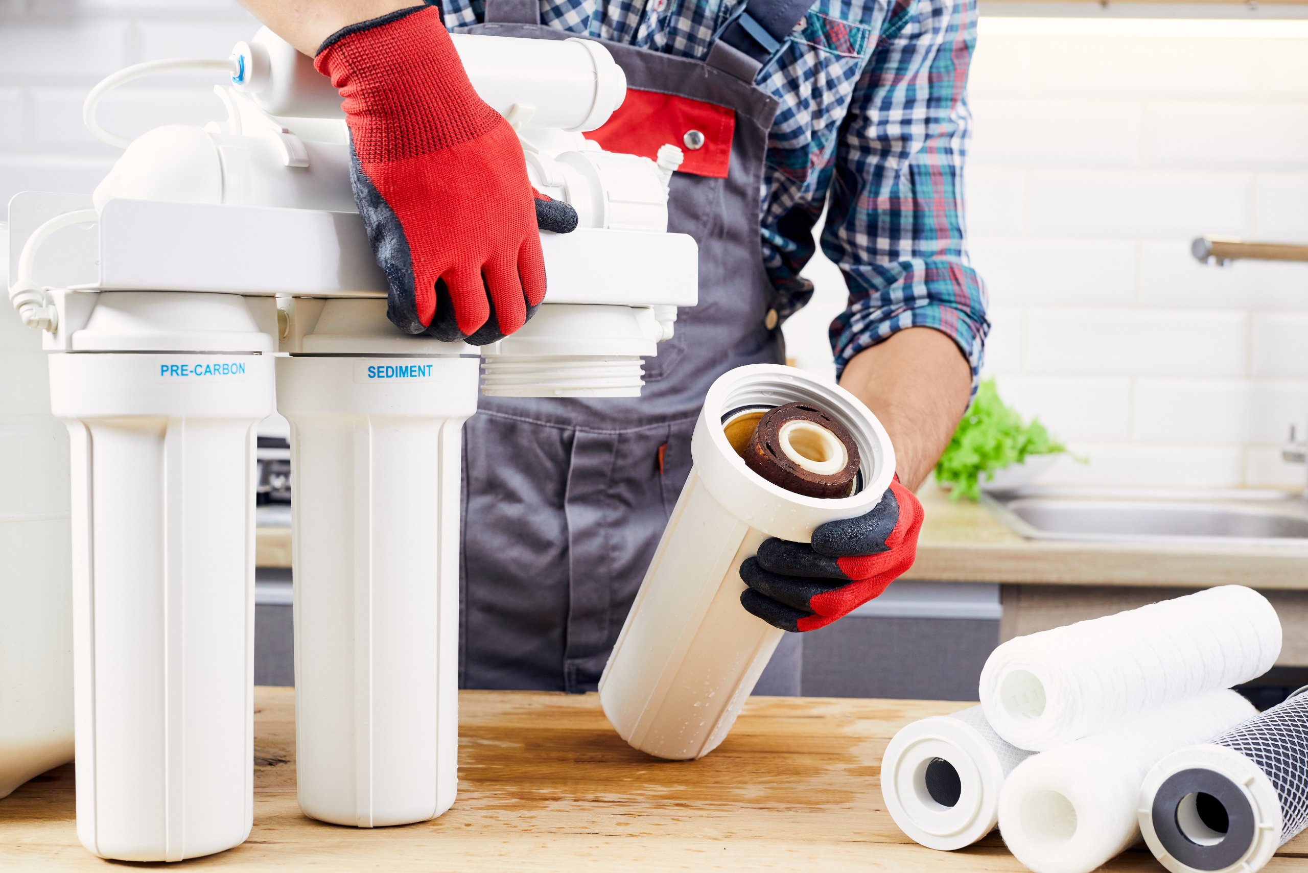 Worker putting together a water filter.