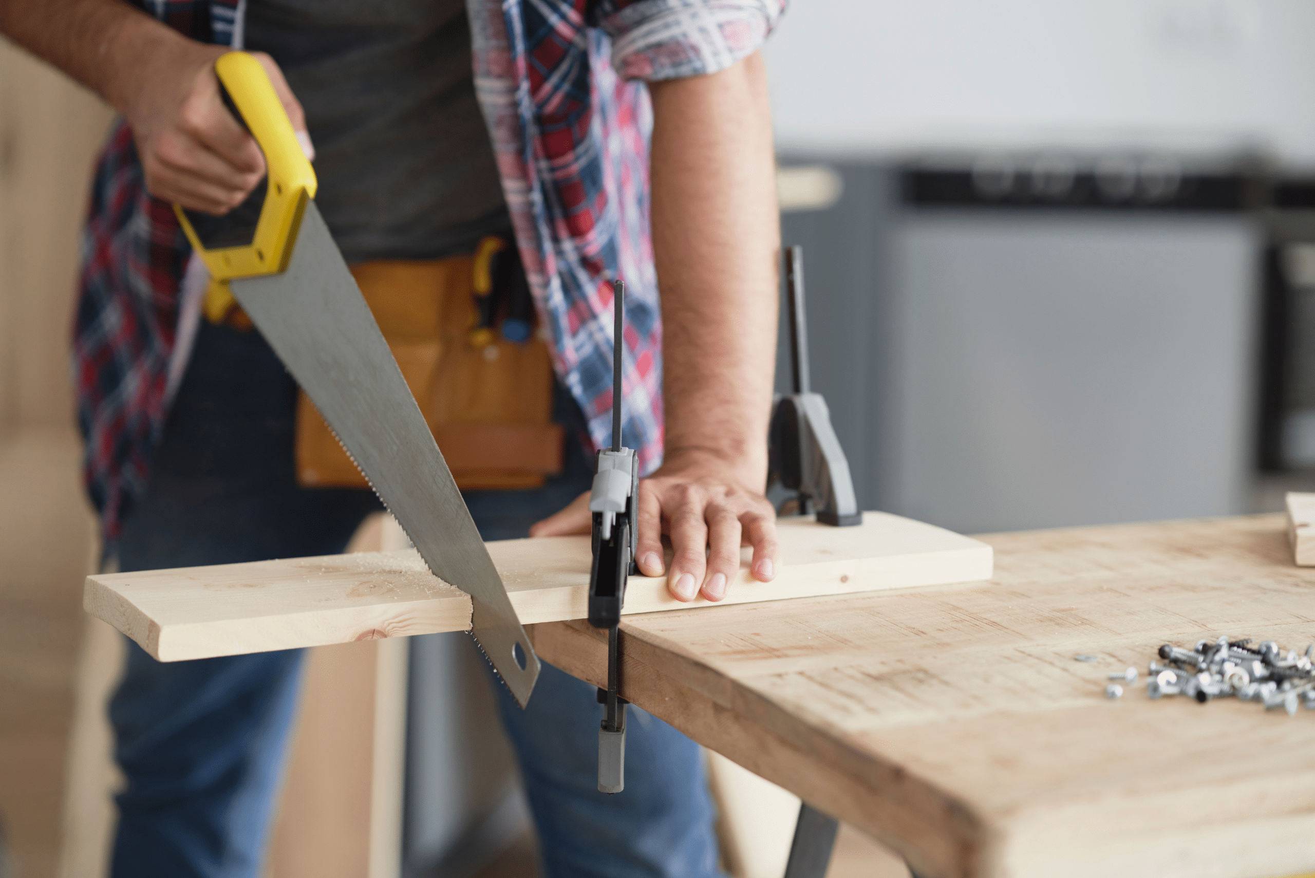 Sawing a board of wood.