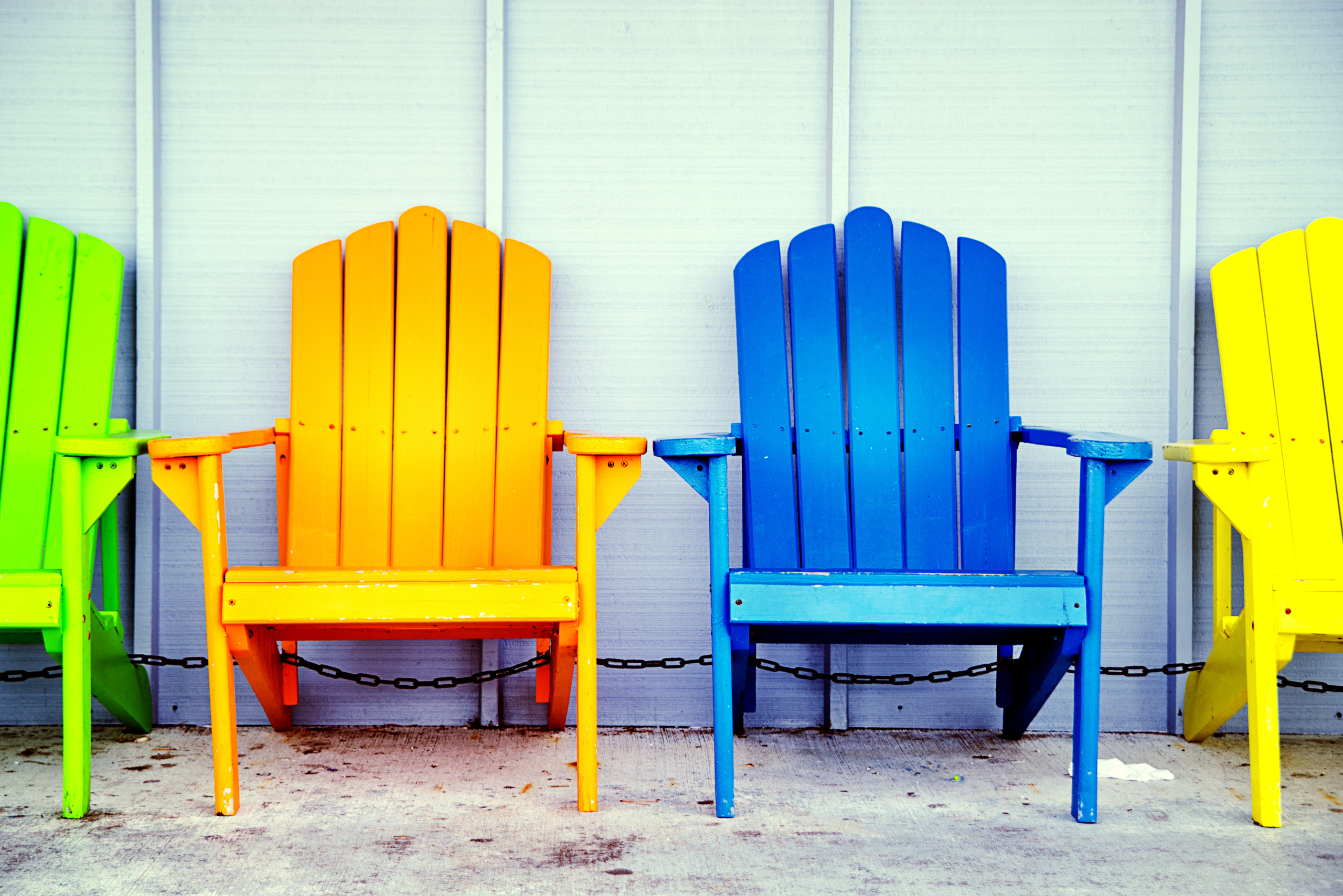 Colorful Adirondack chairs.